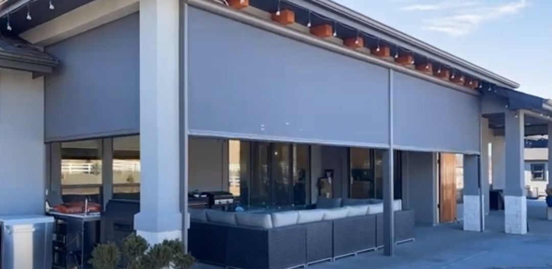 a large building with a lot of windows and a patio area with exterior shades All Window Decor (817) 448-3393.