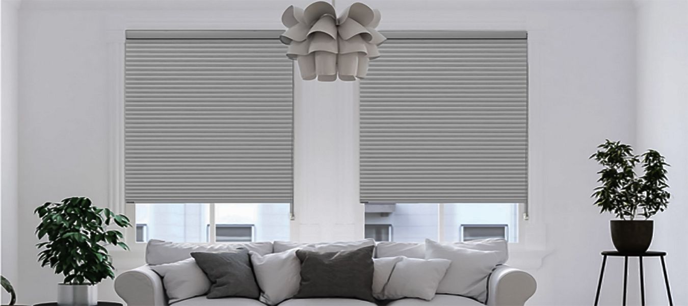 a living room with a white couch and gray blinds All Window Decor (817) 448-3393. services