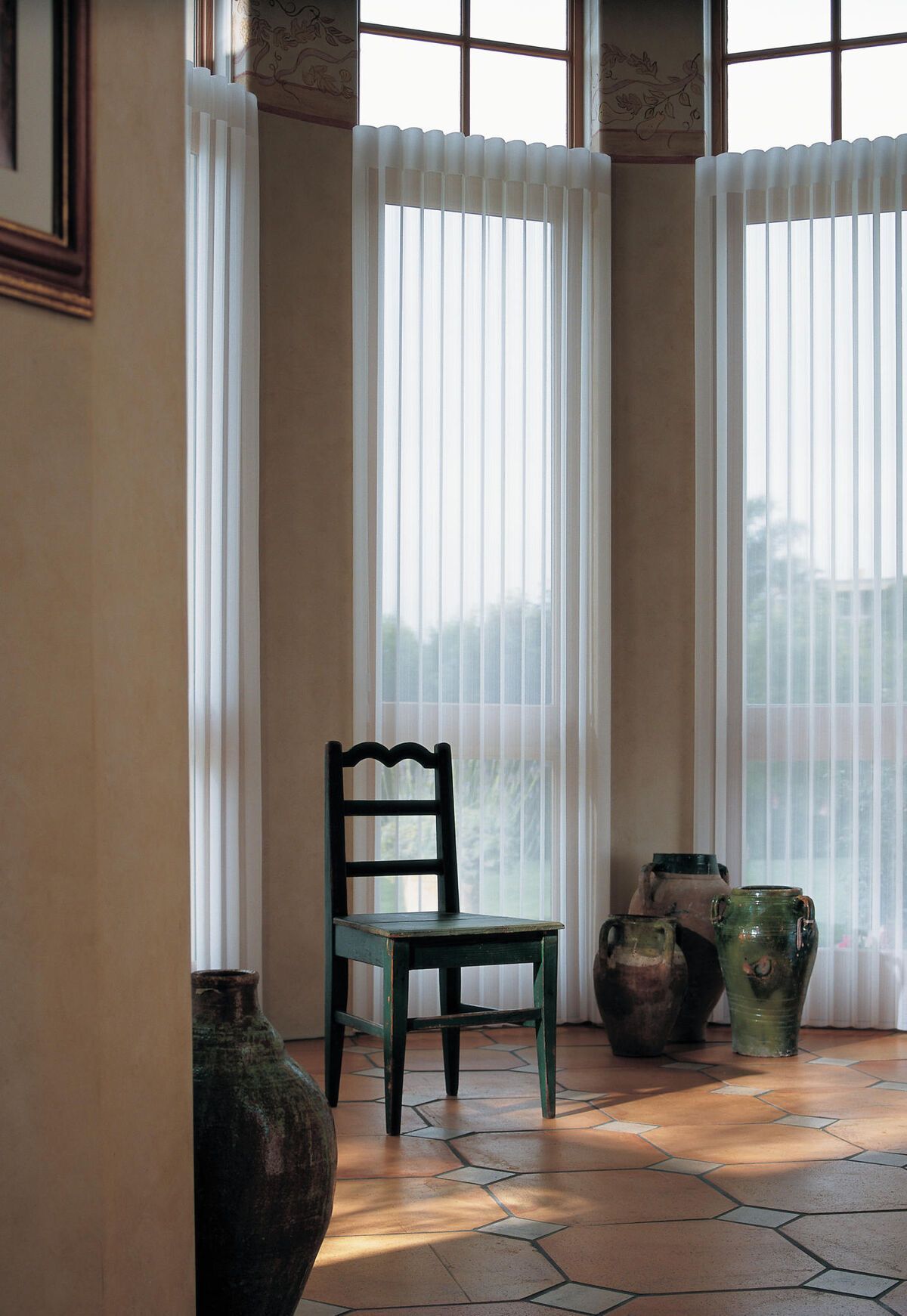 a living room with a lot of furniture and shutters on the windows All Window Decor (817) 448-3393