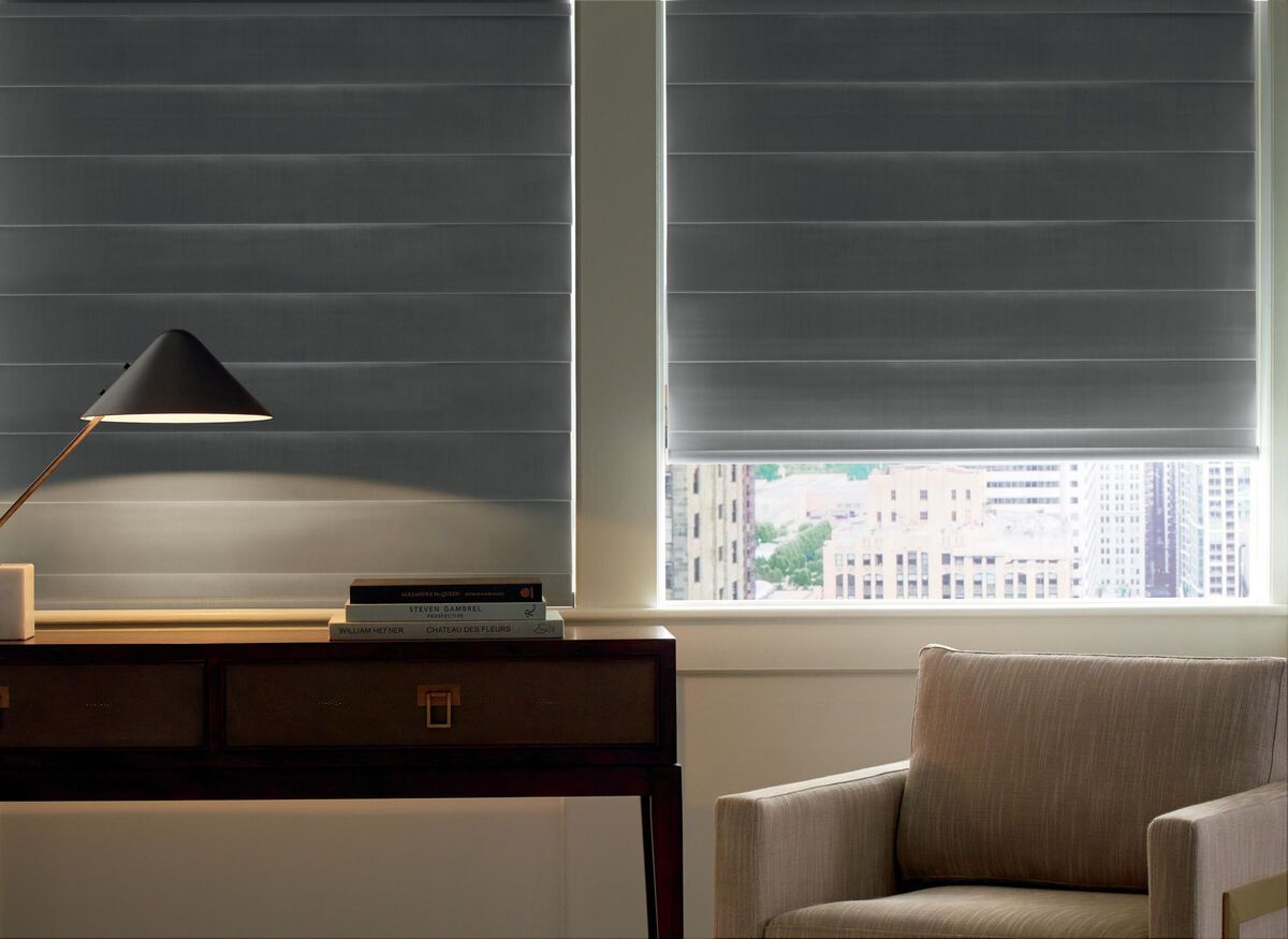a room with a chair a desk and a lamp with privacy shades All Window Decor (817) 448-3393