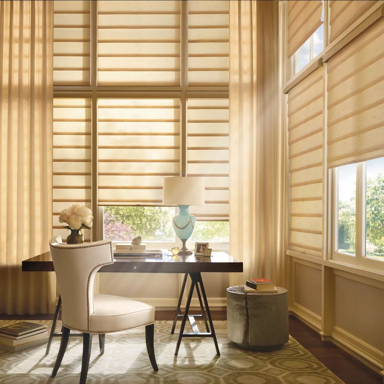 a room with a desk a chair and a lamp and roman shades All Window Decor (817) 448-3393