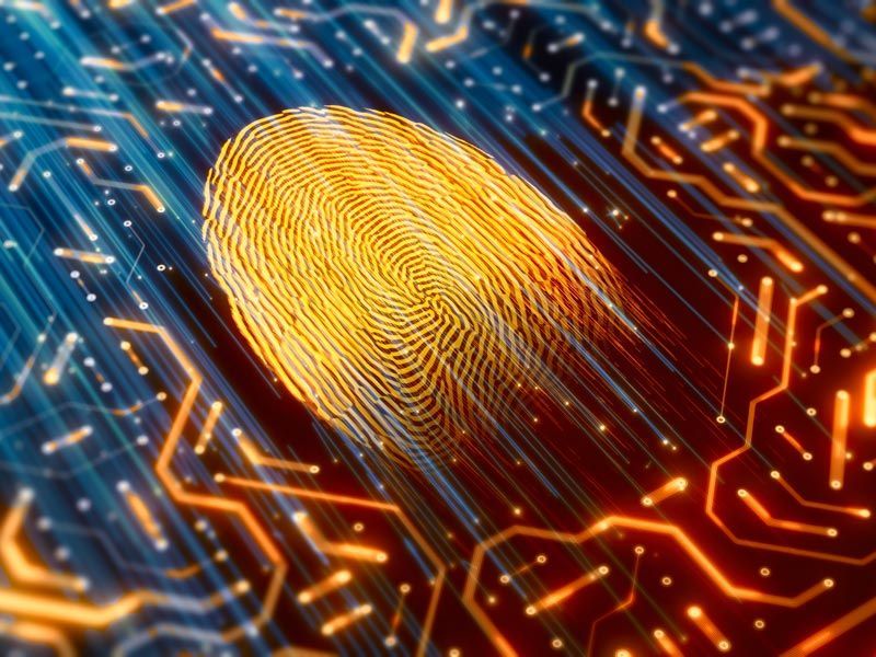Glowing fingerprint on a blue and orange digital circuit board background