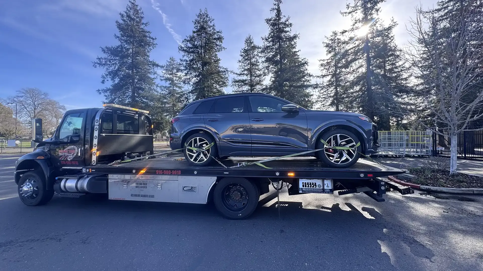 A car is being towed by a tow truck.
