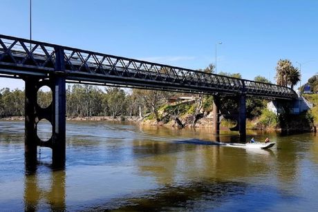 A Boat Is Going Under A Bridge — Diverse Poolcare–Pool Fence Inspections & Compliance Certificates In Corowa, NSW