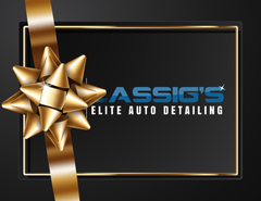 LASSIG'S Elite Auto Detailing logo on a black background with a gold ribbon and bow