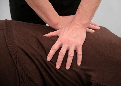 Chiropractor Doing a Press on the Back — Wichita, KS — Advanced Chiropractic Chiropractor Doing a Press on the Back — Wichita, KS — Advanced Chiropractic
