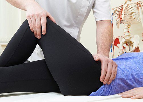 Treating Female Patient With Hip Problem — Wichita, KS — Advanced Chiropractic Treating Female Patient With Hip Problem — Wichita, KS — Advanced Chiropractic