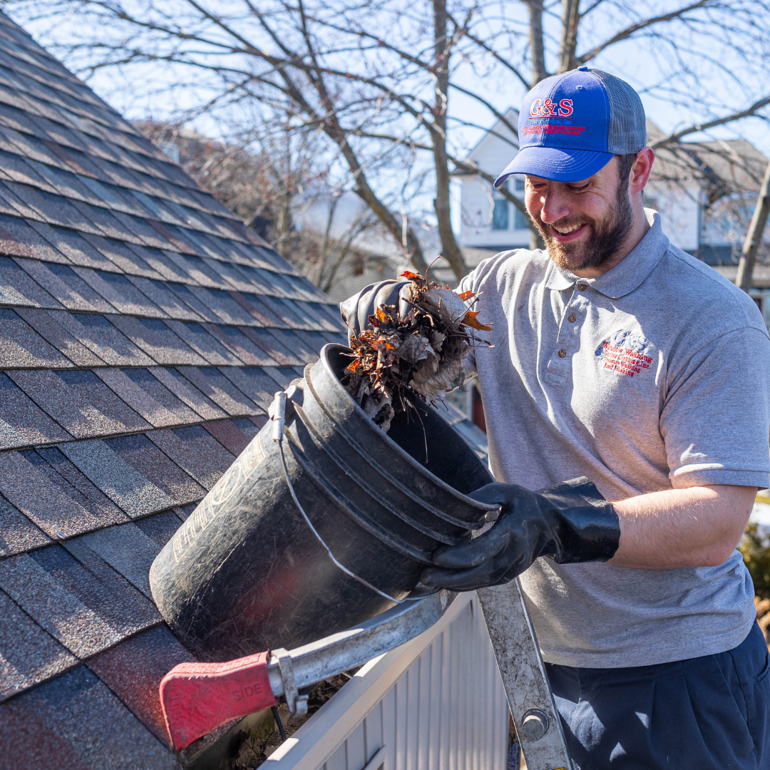 G&S employee performing gutter cleaning