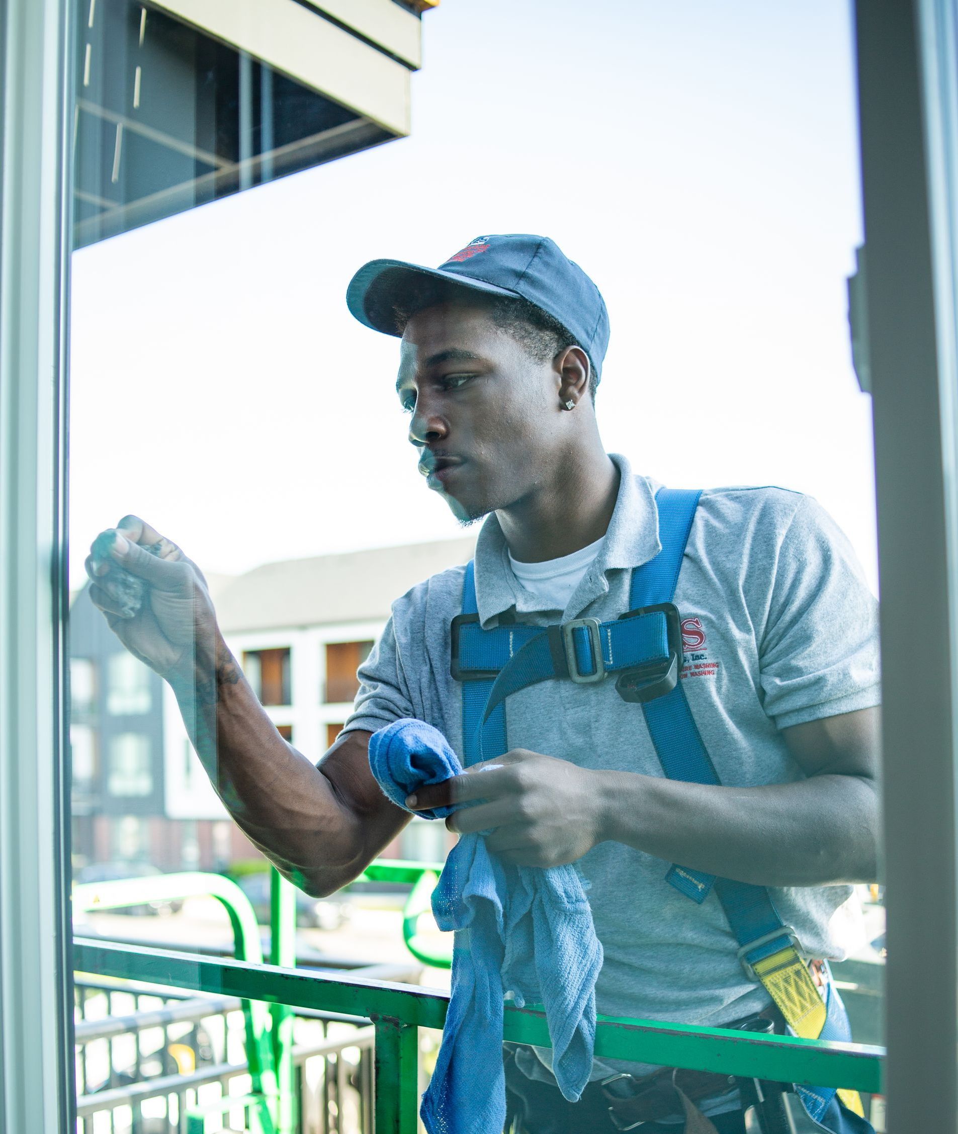 G&S employee performing window washing