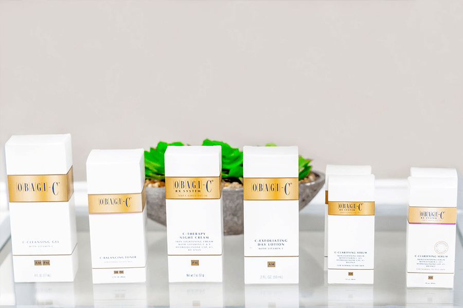 A row of obagi products are lined up on a shelf