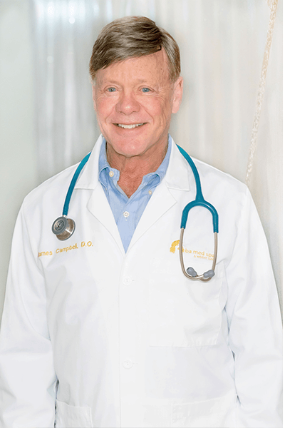 A man in a white lab coat with a stethoscope around his neck.
