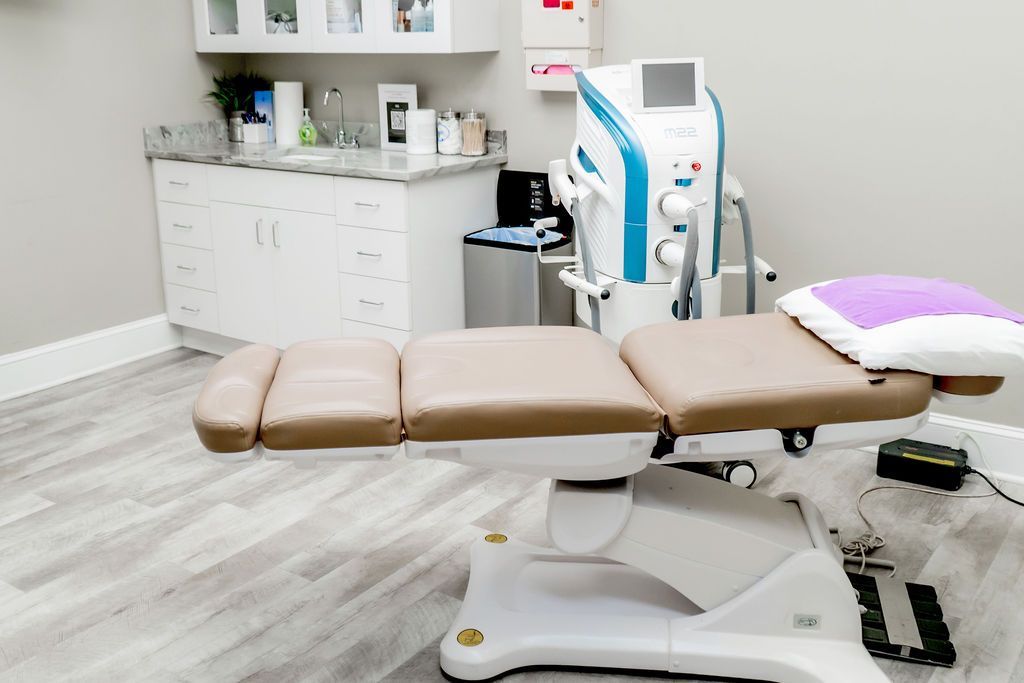 A dental office with a chair and a machine.