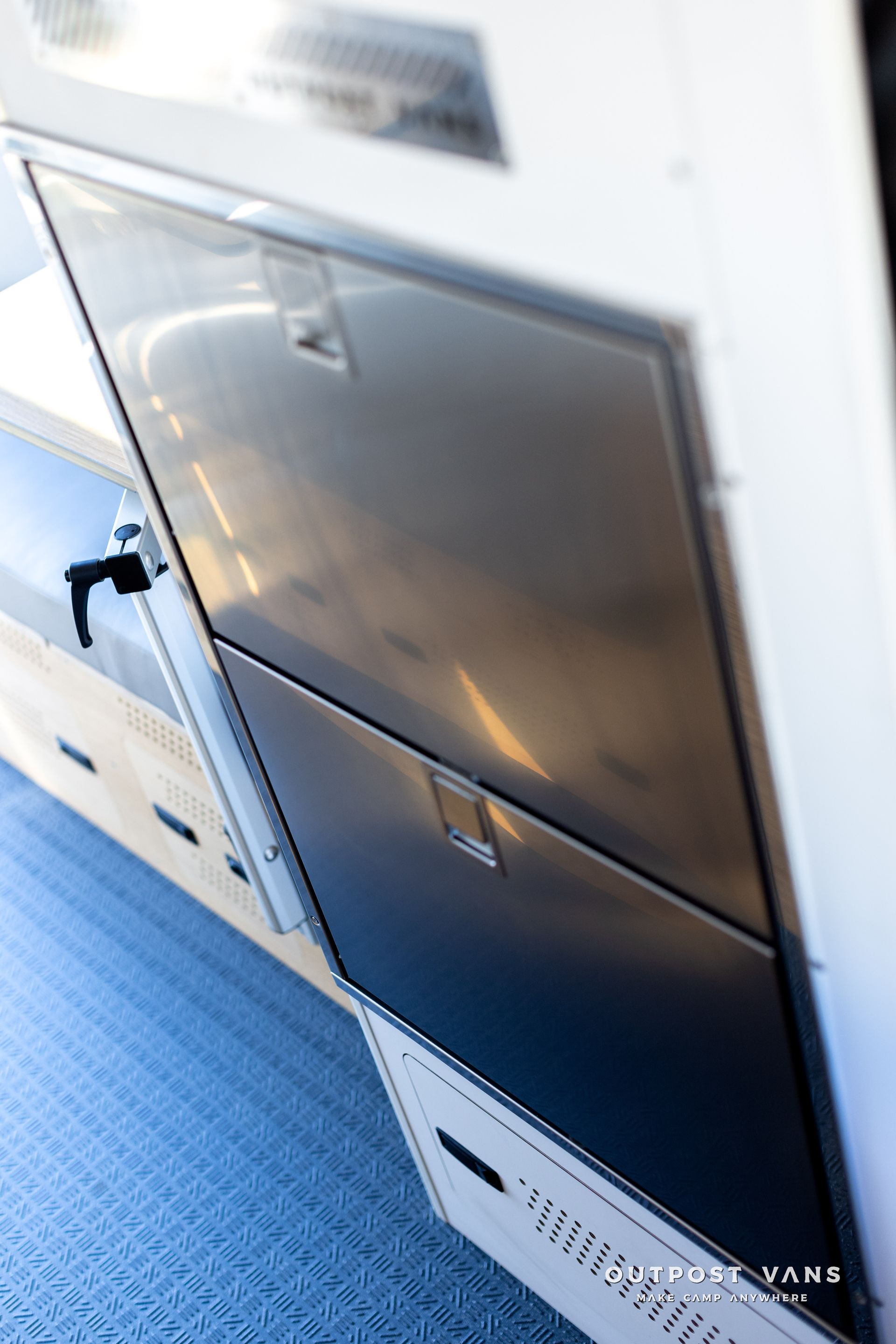 A close up of a stainless steel refrigerator in a kitchen