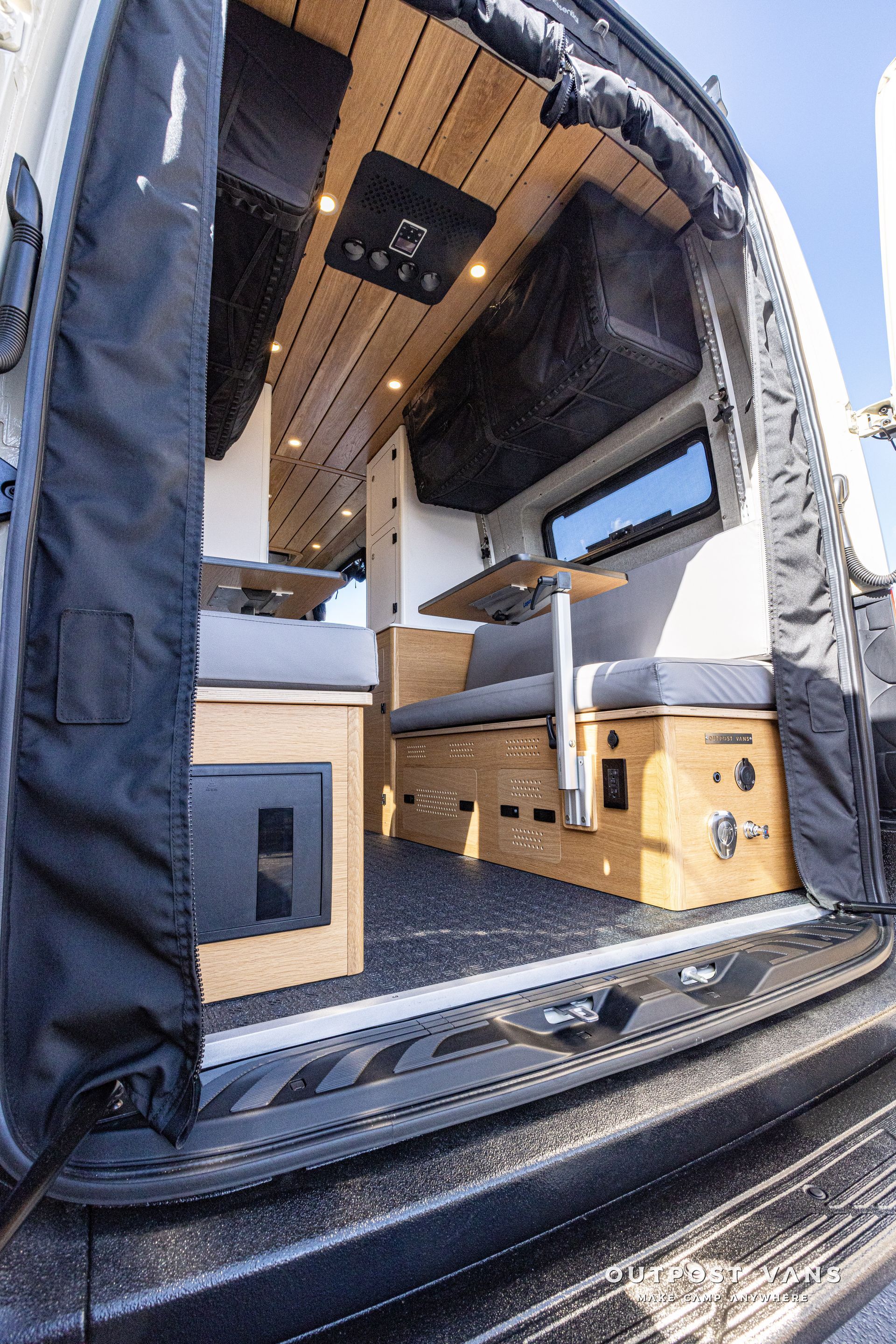 The inside of a camper van with the door open.