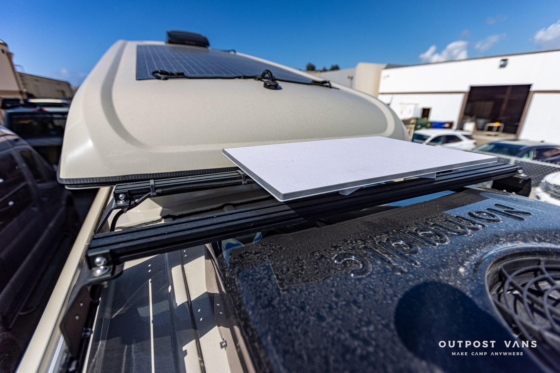 A car with a solar panel on top of it.