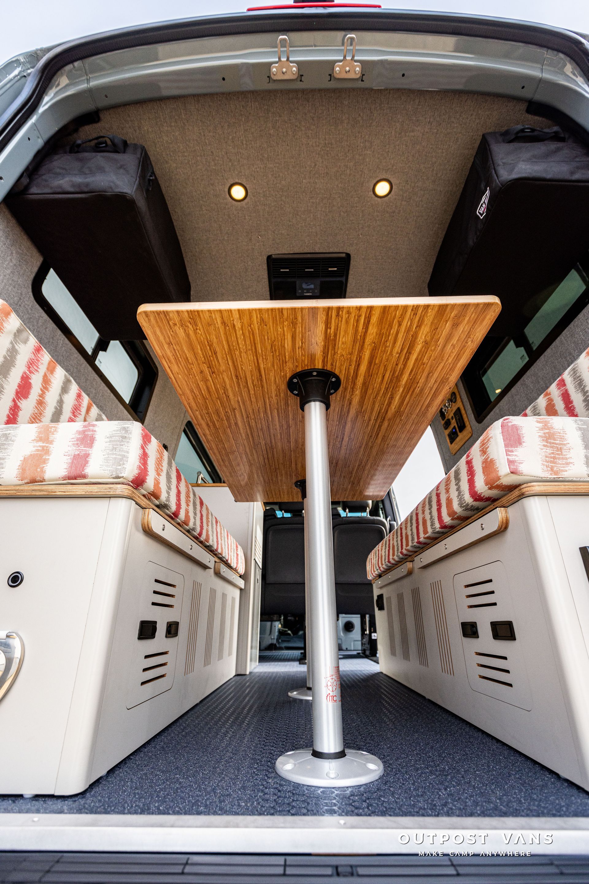 There is a table in the back of a van.