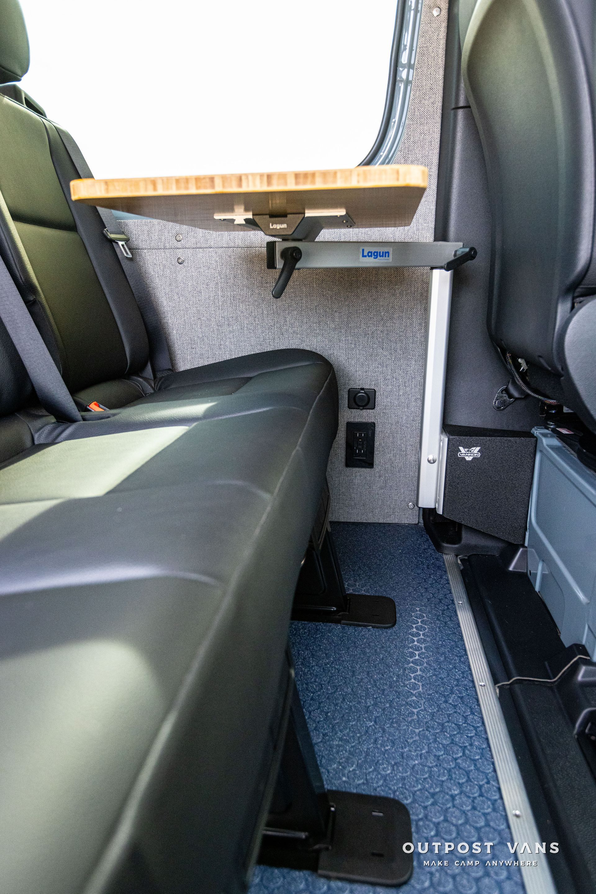 There is a table in the back seat of a car.