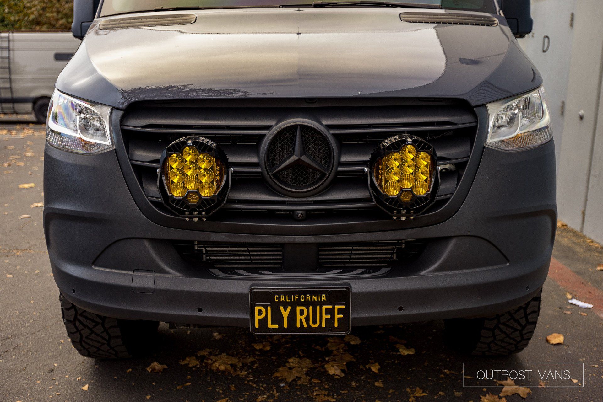A mercedes van with a license plate