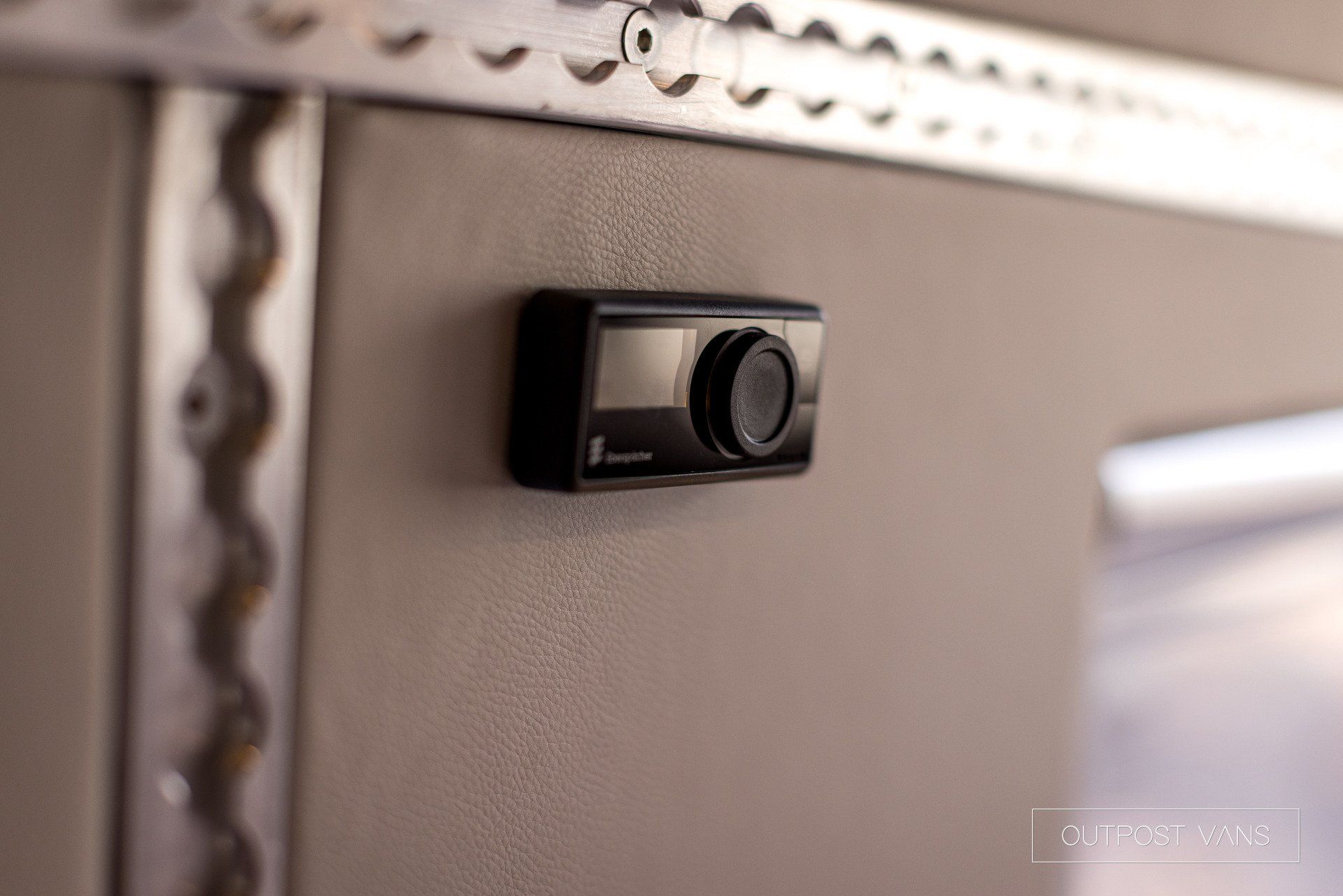 A close up of a camera mounted on a wall.