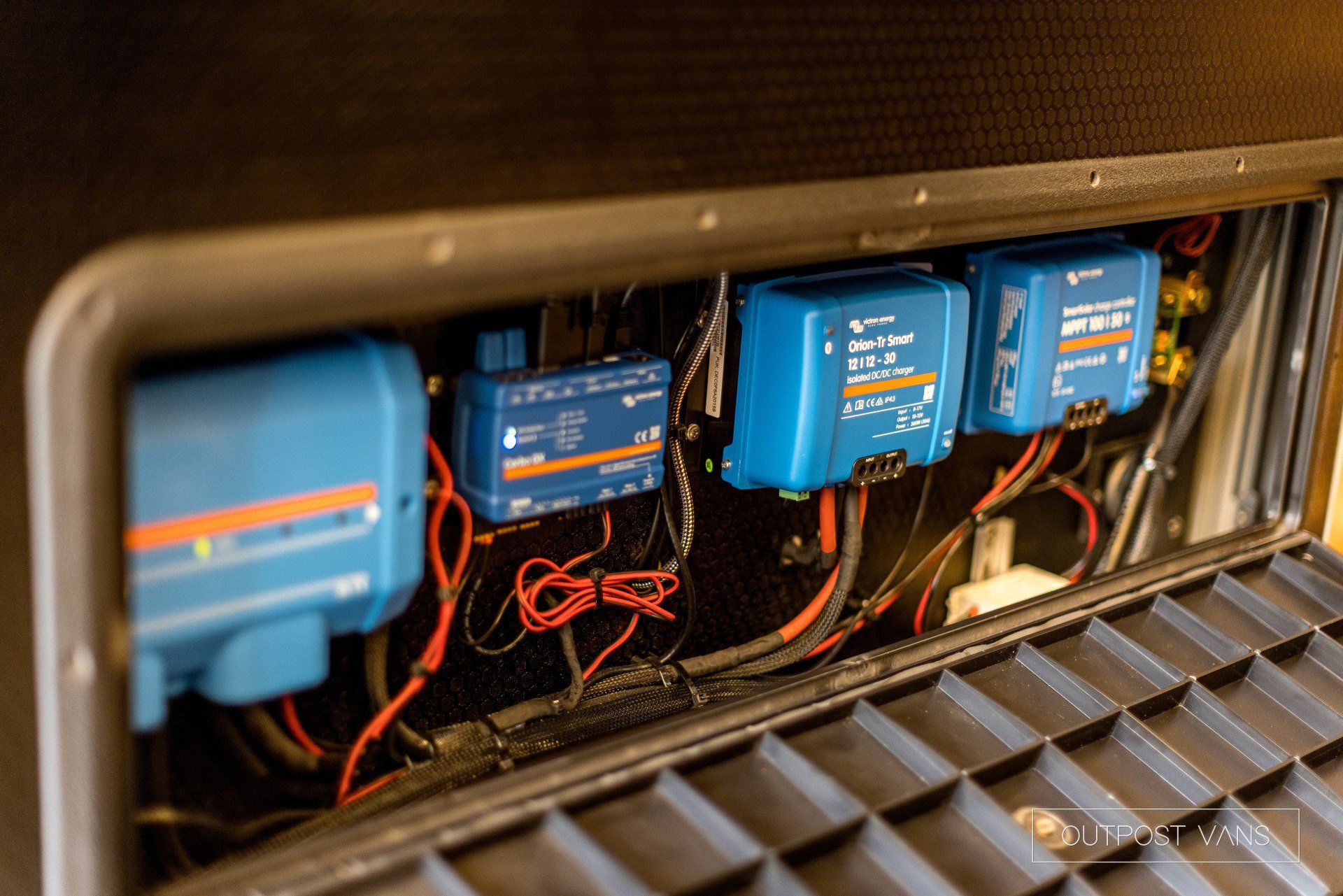 A close up of a box with a bunch of wires coming out of it.