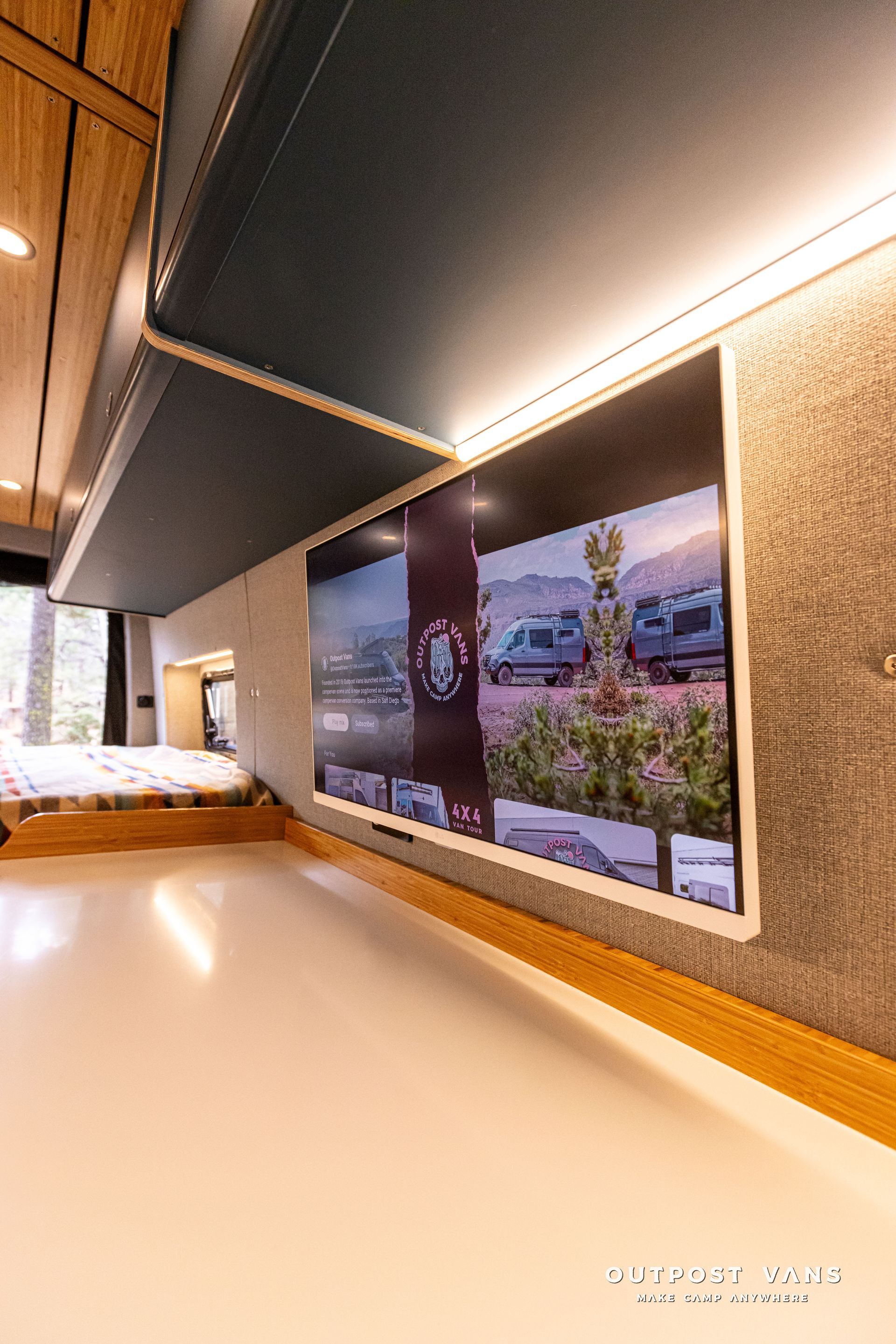 A long hallway with a large picture on the wall.
