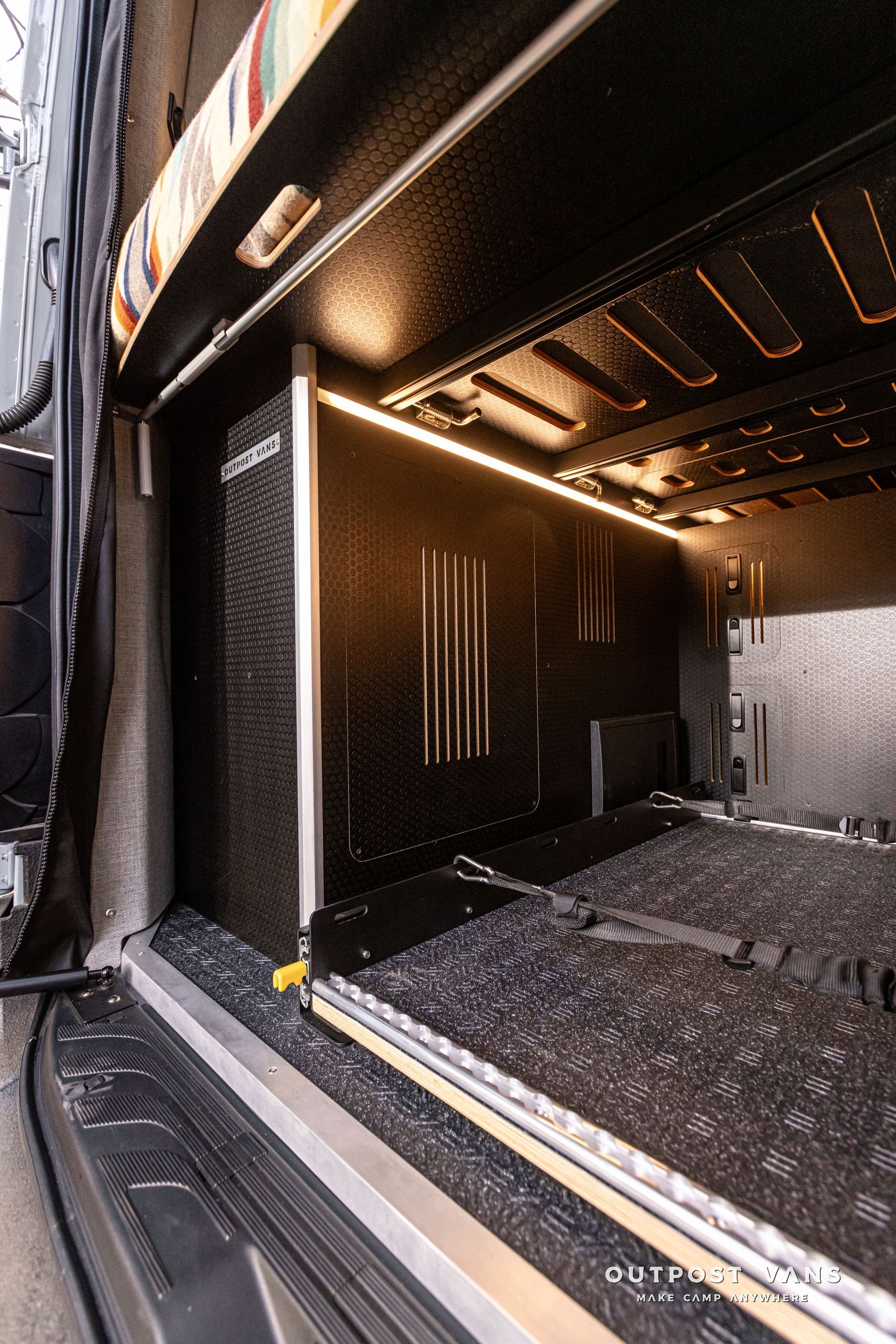 A close up of the inside of a van with the door open.