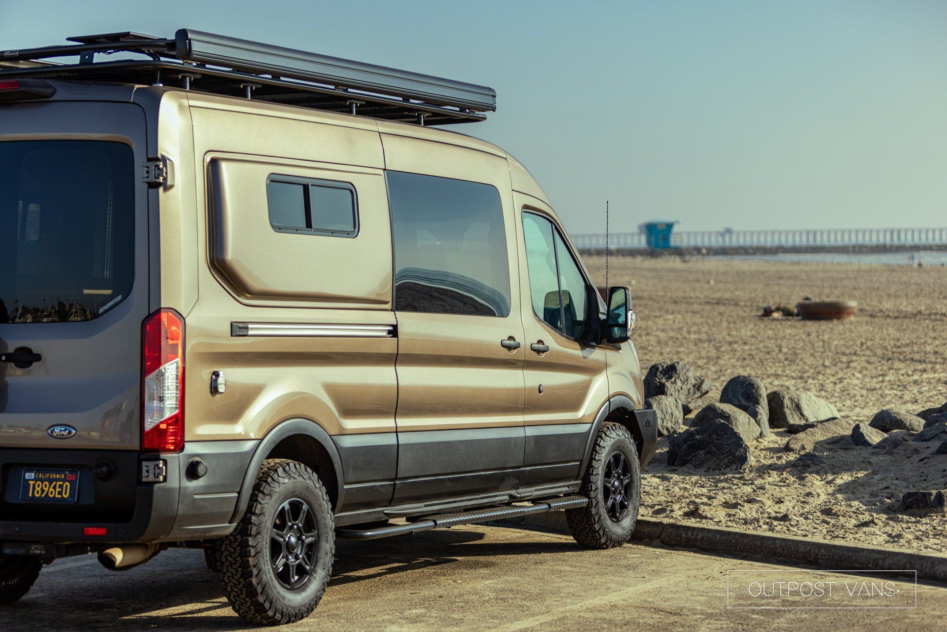 a van is parked on the side of the road in the desert .