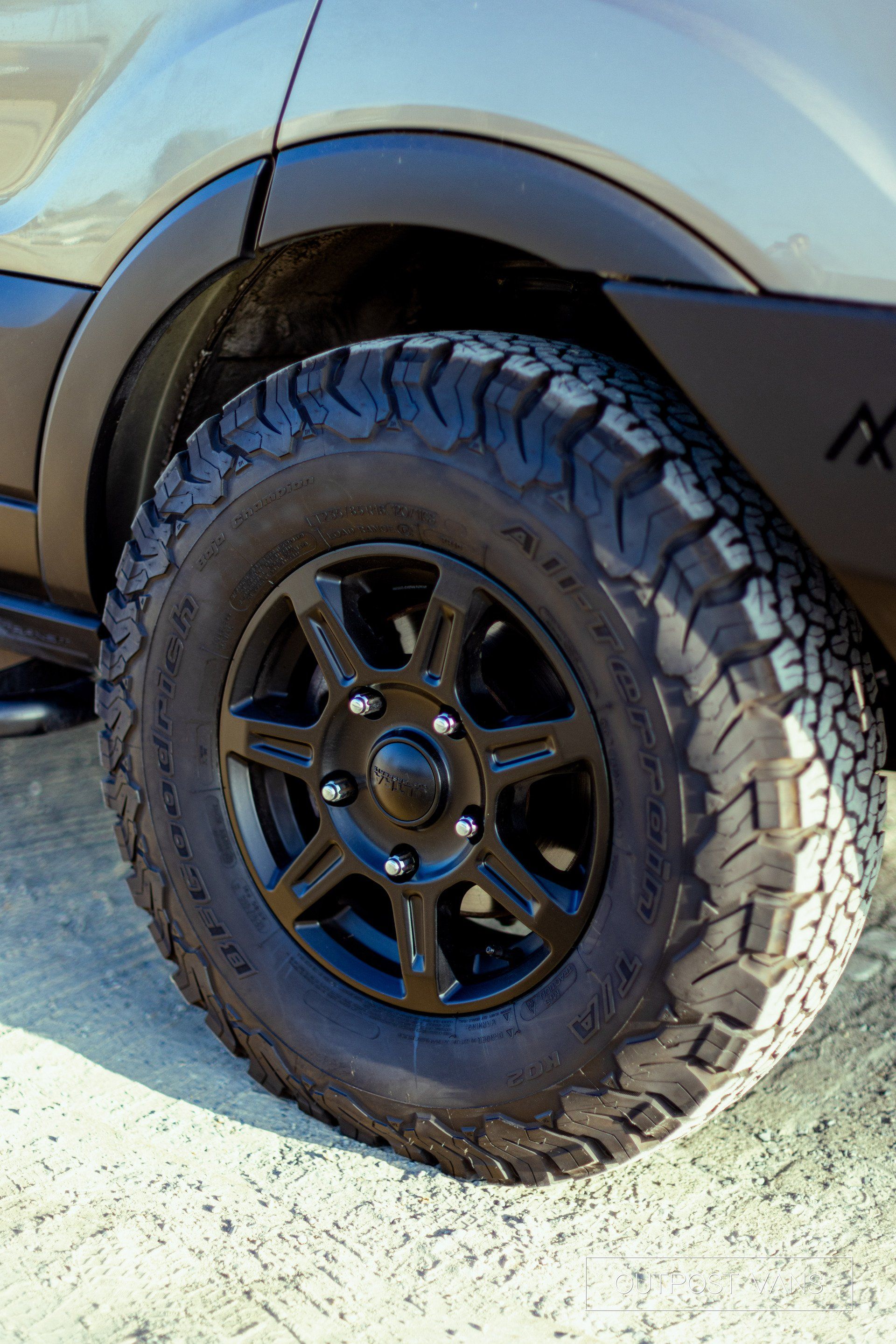 a close up of a car wheel with a tire on it .