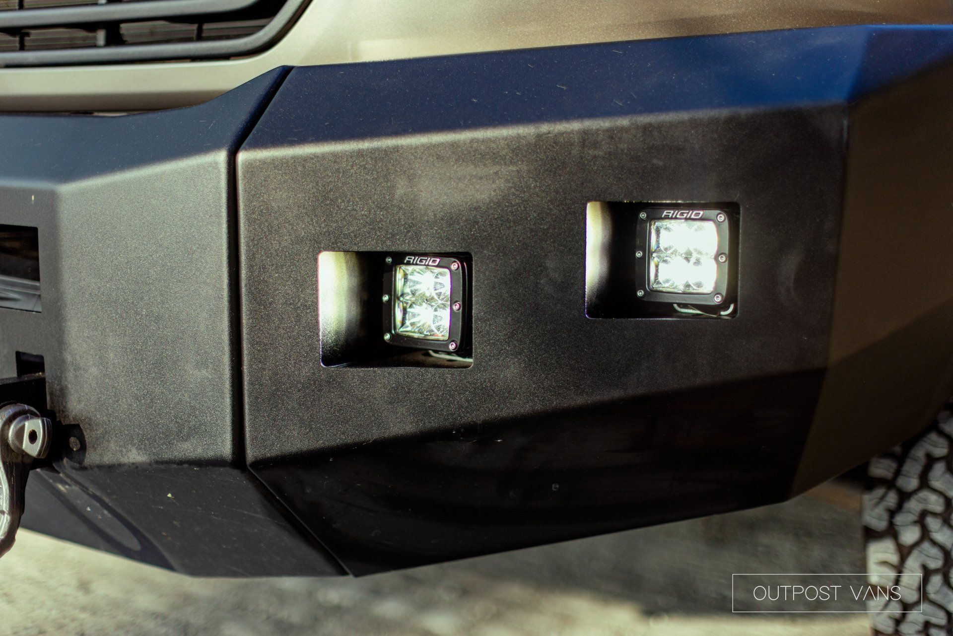 a close up of the front bumper of a truck with lights on it .