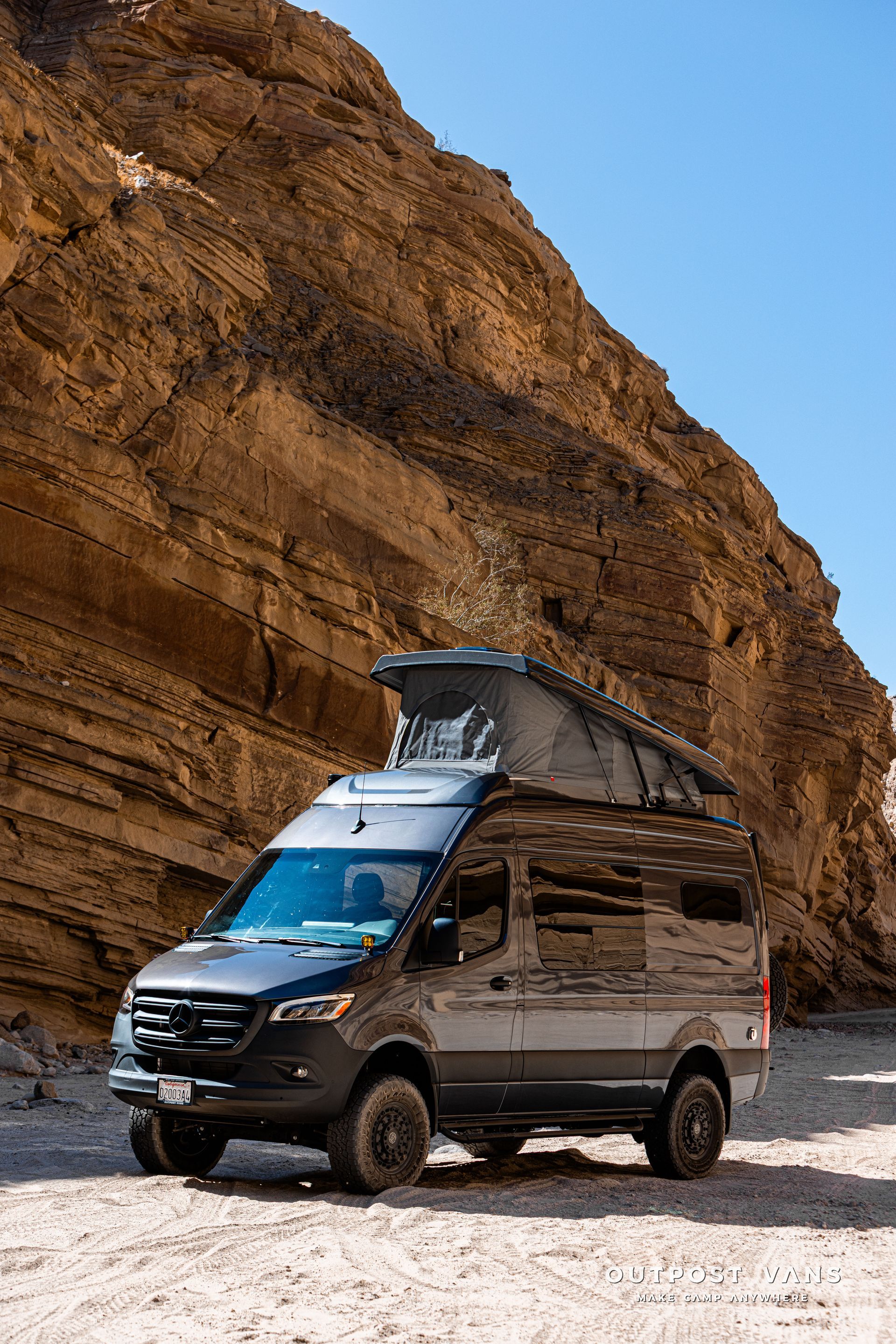 A sprinter van with a sca pop åtop at Fish Creek Anza Borrego