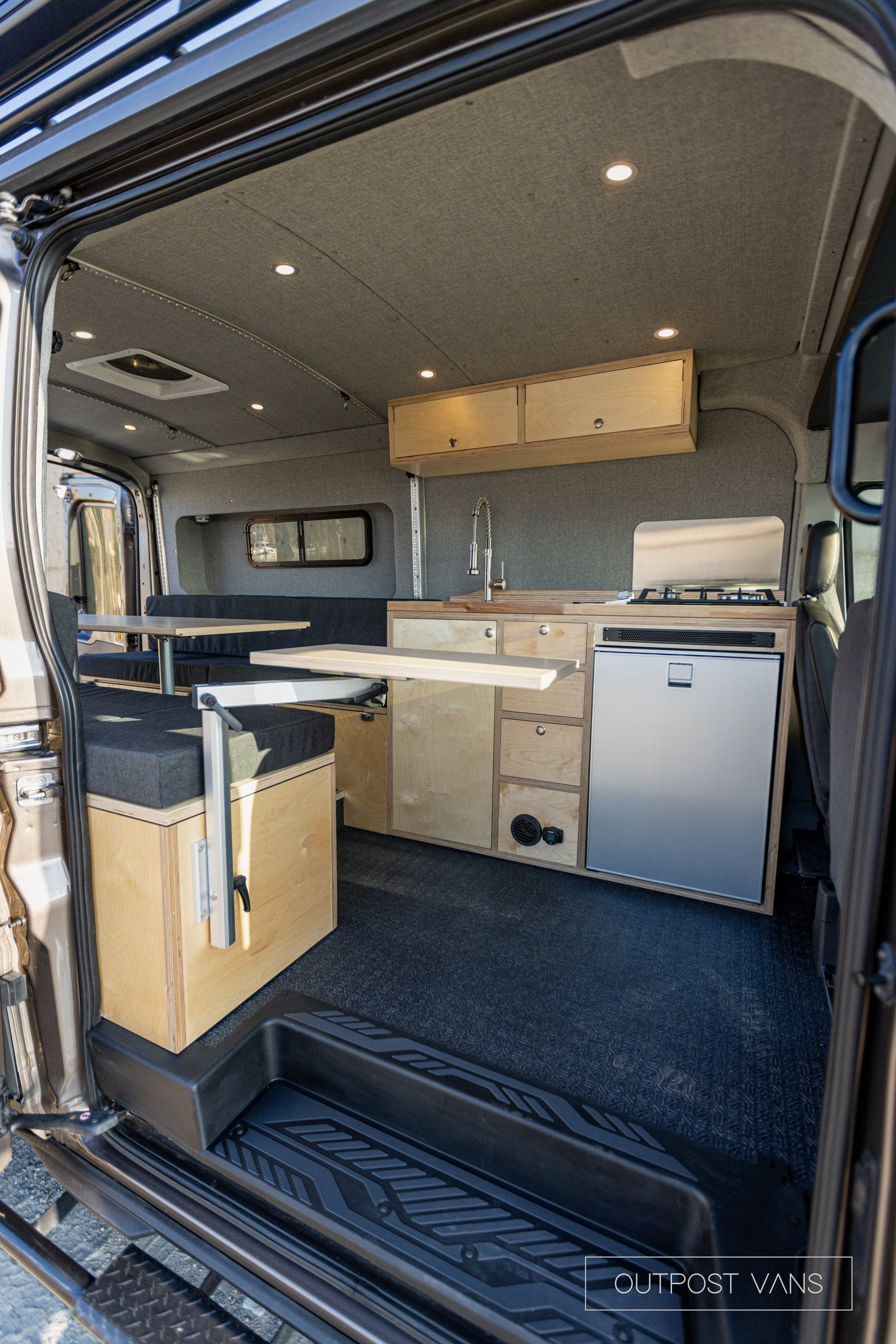 the inside of a camper van with the door open .