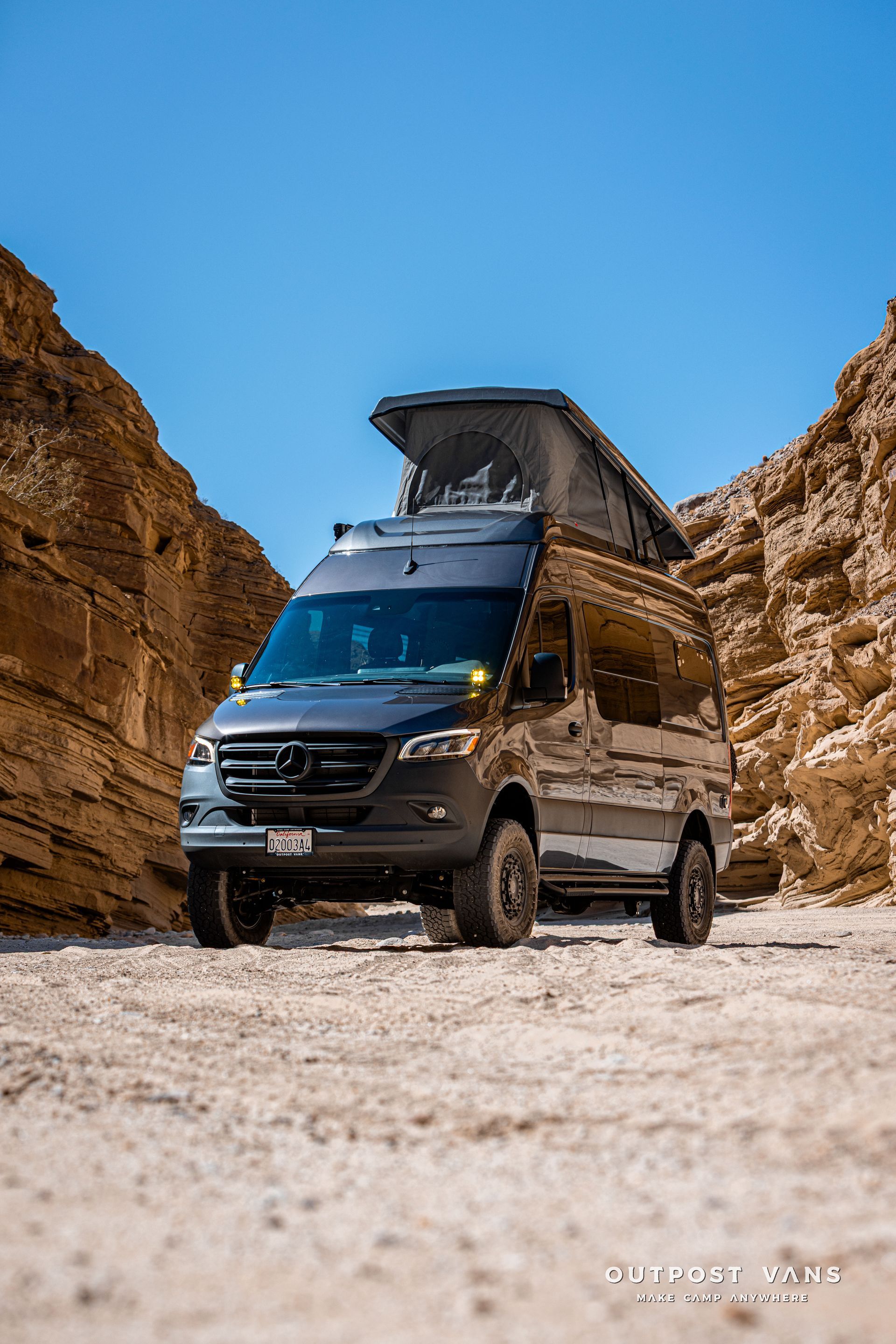 A sprinter van with a sca pop åtop at Fish Creek Anza Borrego