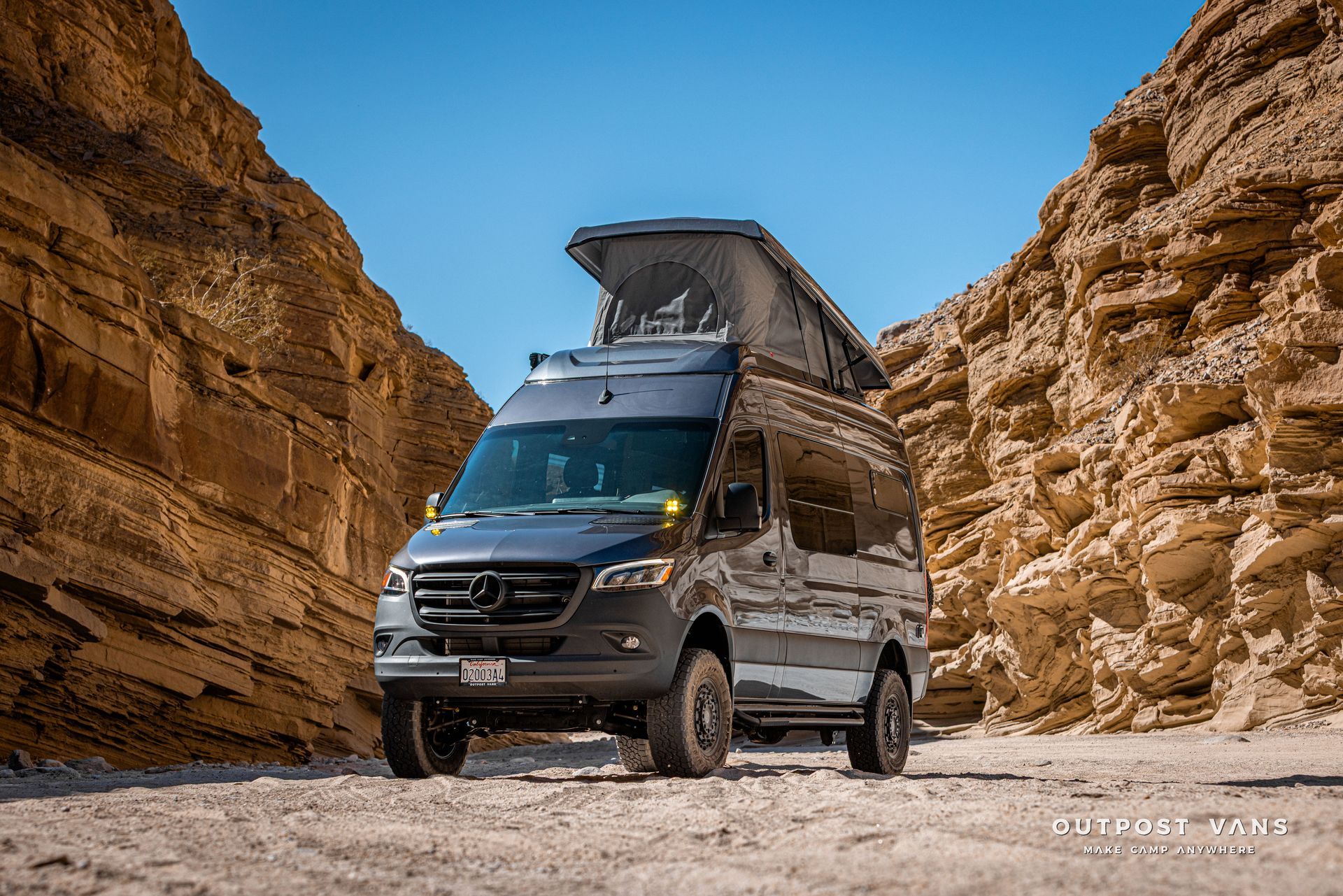 A sprinter van with a sca pop åtop at Fish Creek Anza Borrego