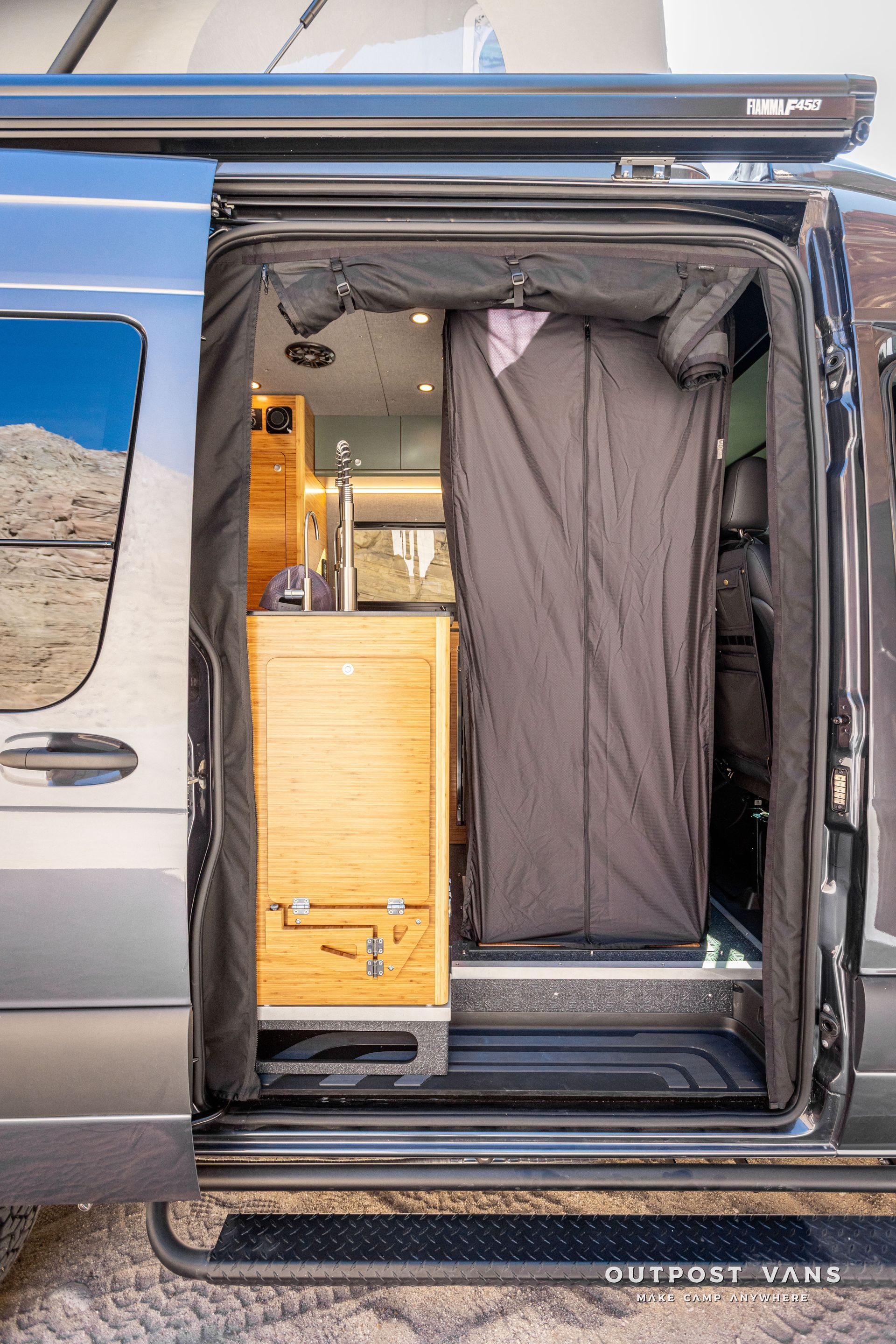 camper van in floor shower pan with bamboo insert shower hose and mixer