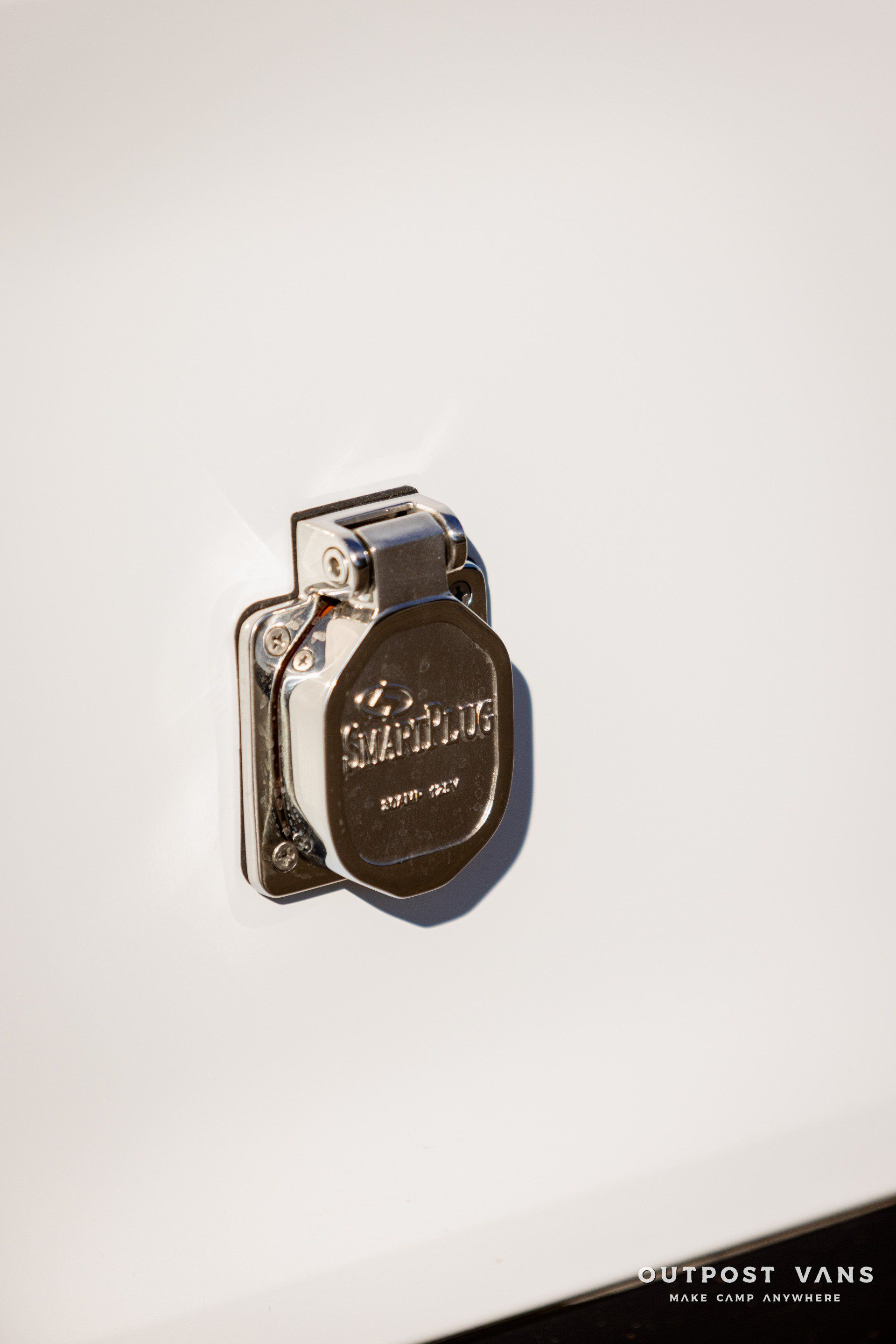 a close up of a plug on a white wall .
