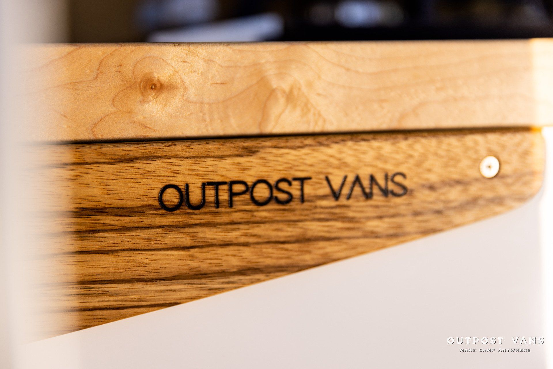 a wooden box with the word outpost vans written on it