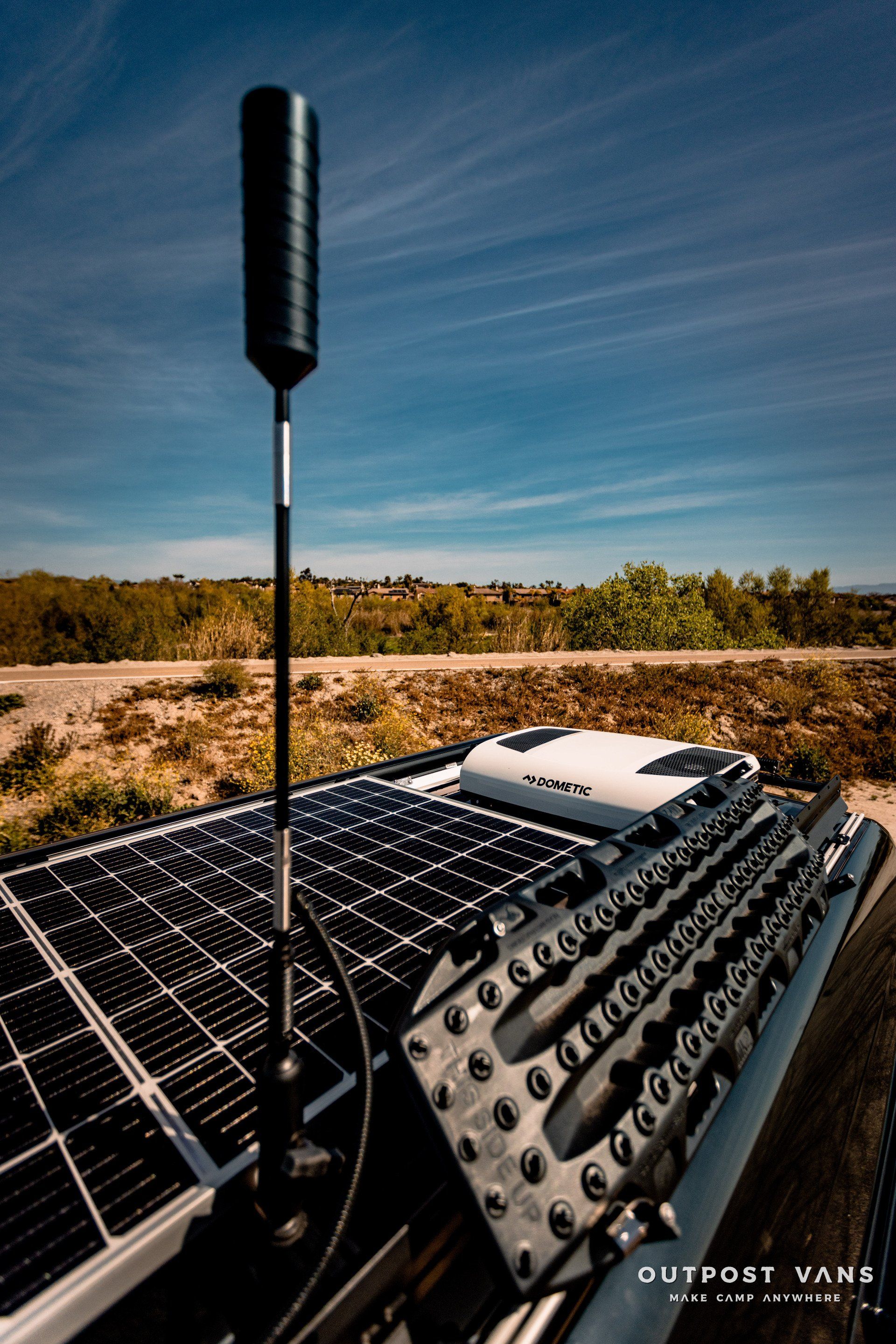 A solar panel is sitting on top of a vehicle.