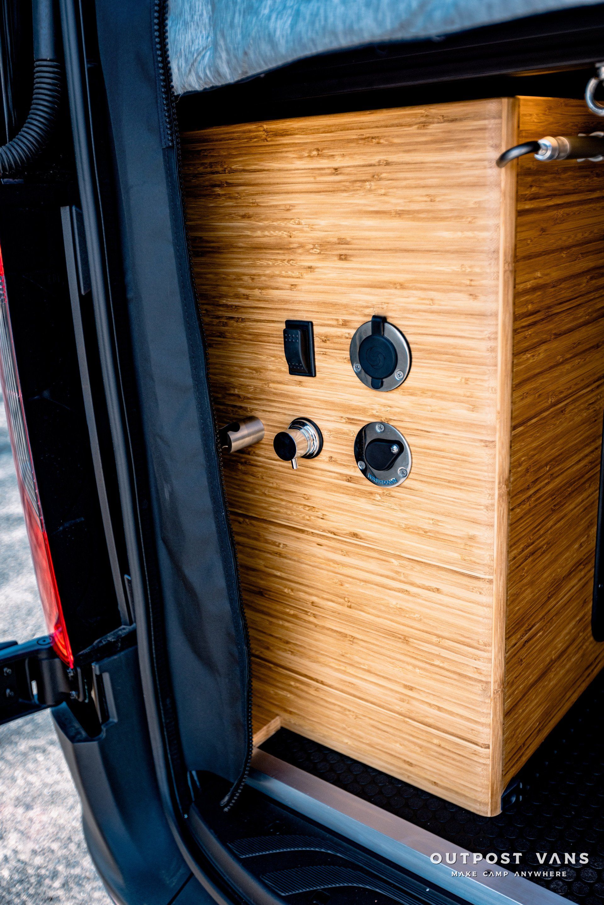 A close up of a wooden box in the back of a van.