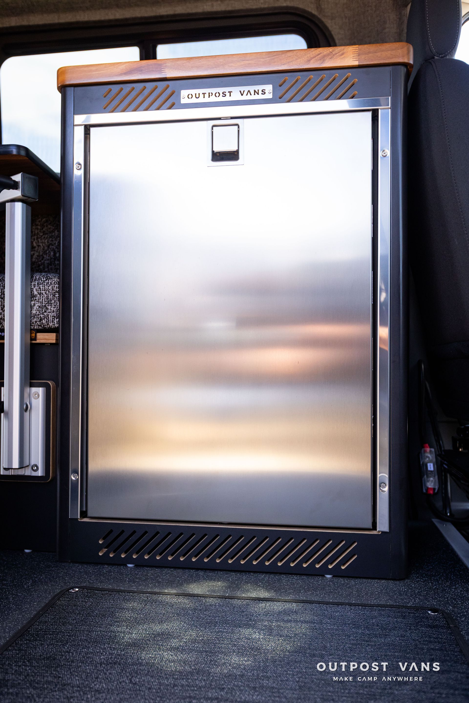 Outpost Vans custom built camper van Ford Transit 148 AWD. 12v fridge isotherm cruise 130 drawer