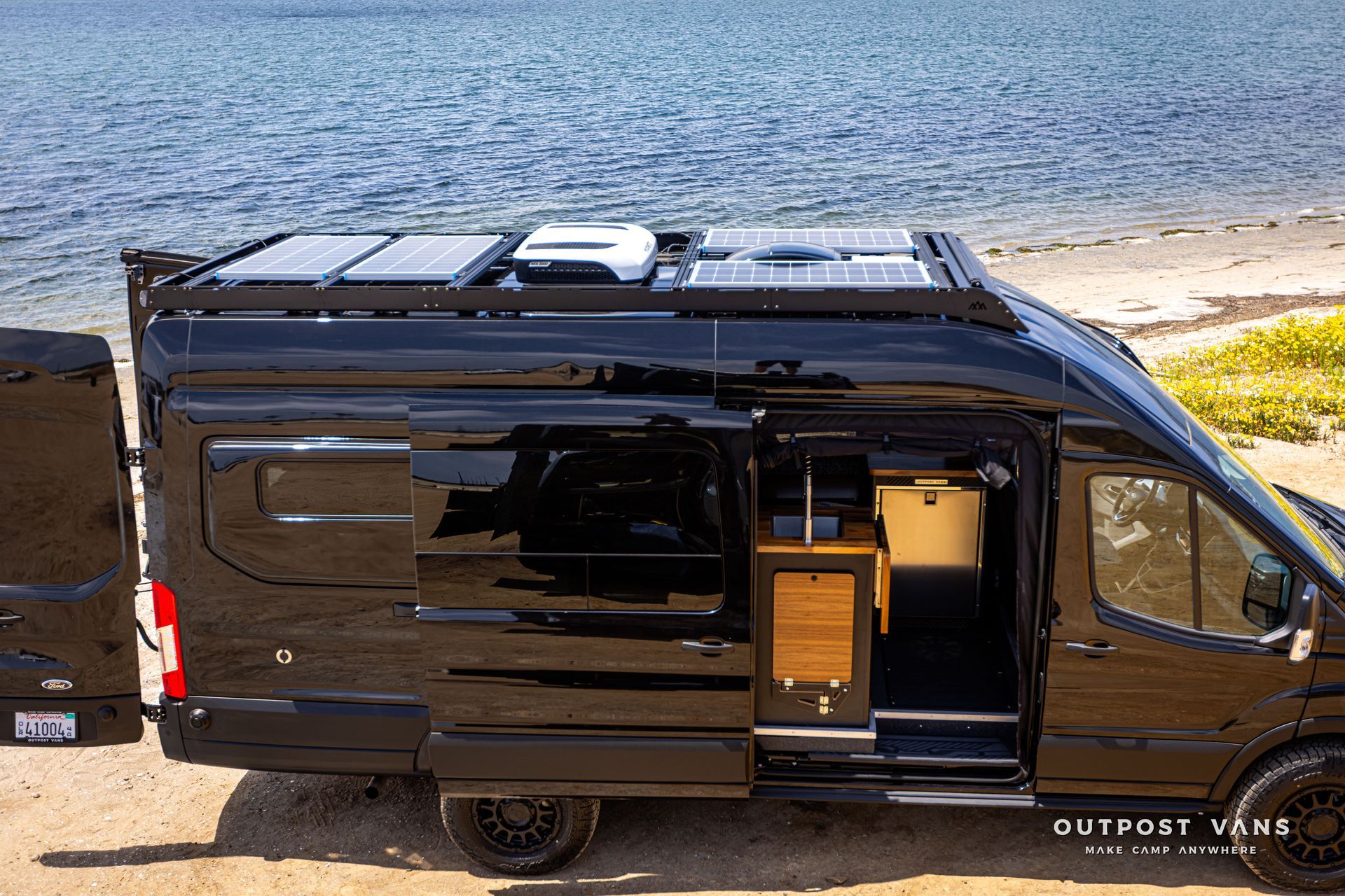 Outpost Vans custom built camper van Ford Transit 148 AWD.