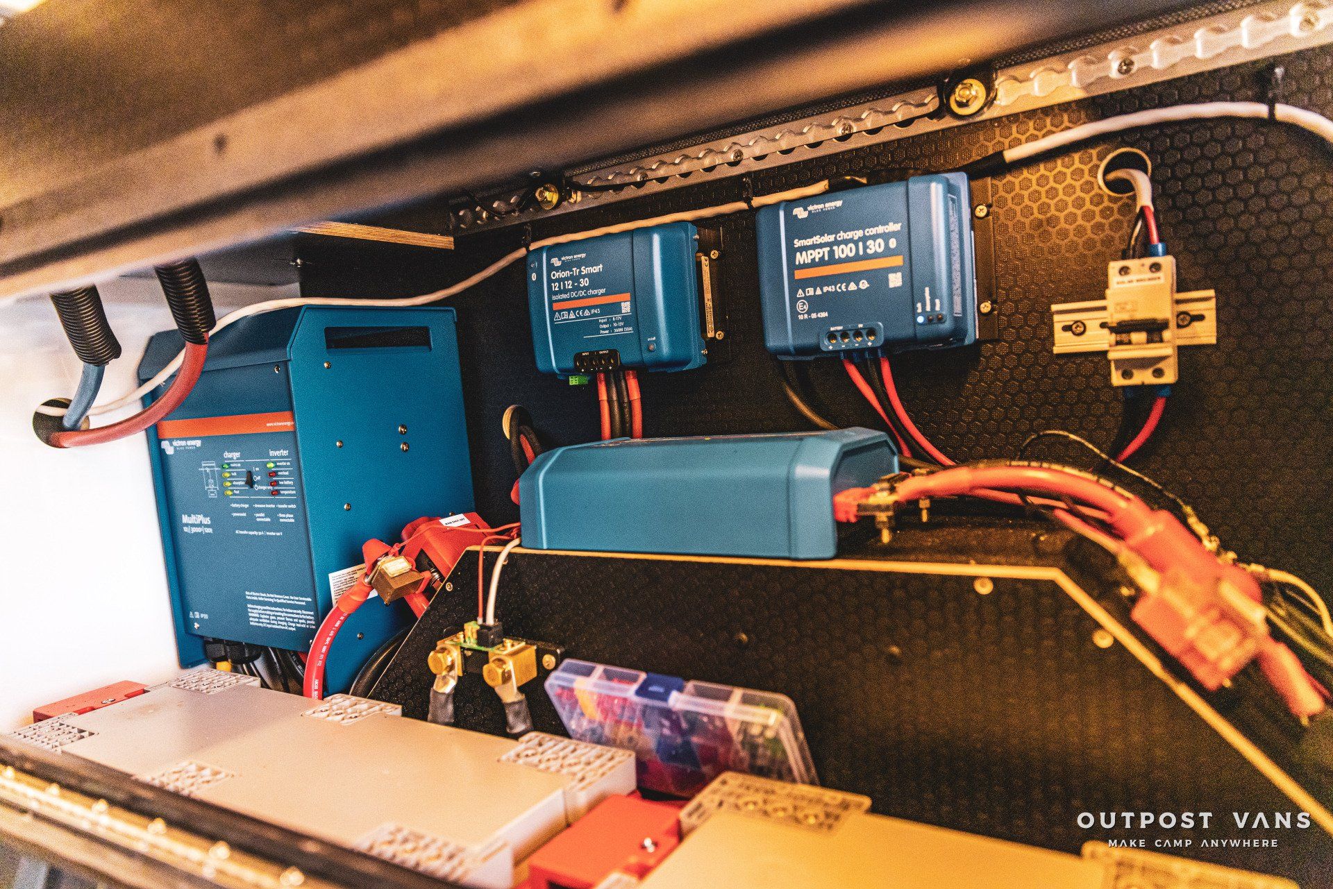 The inside of a van with a lot of wires coming out of it.