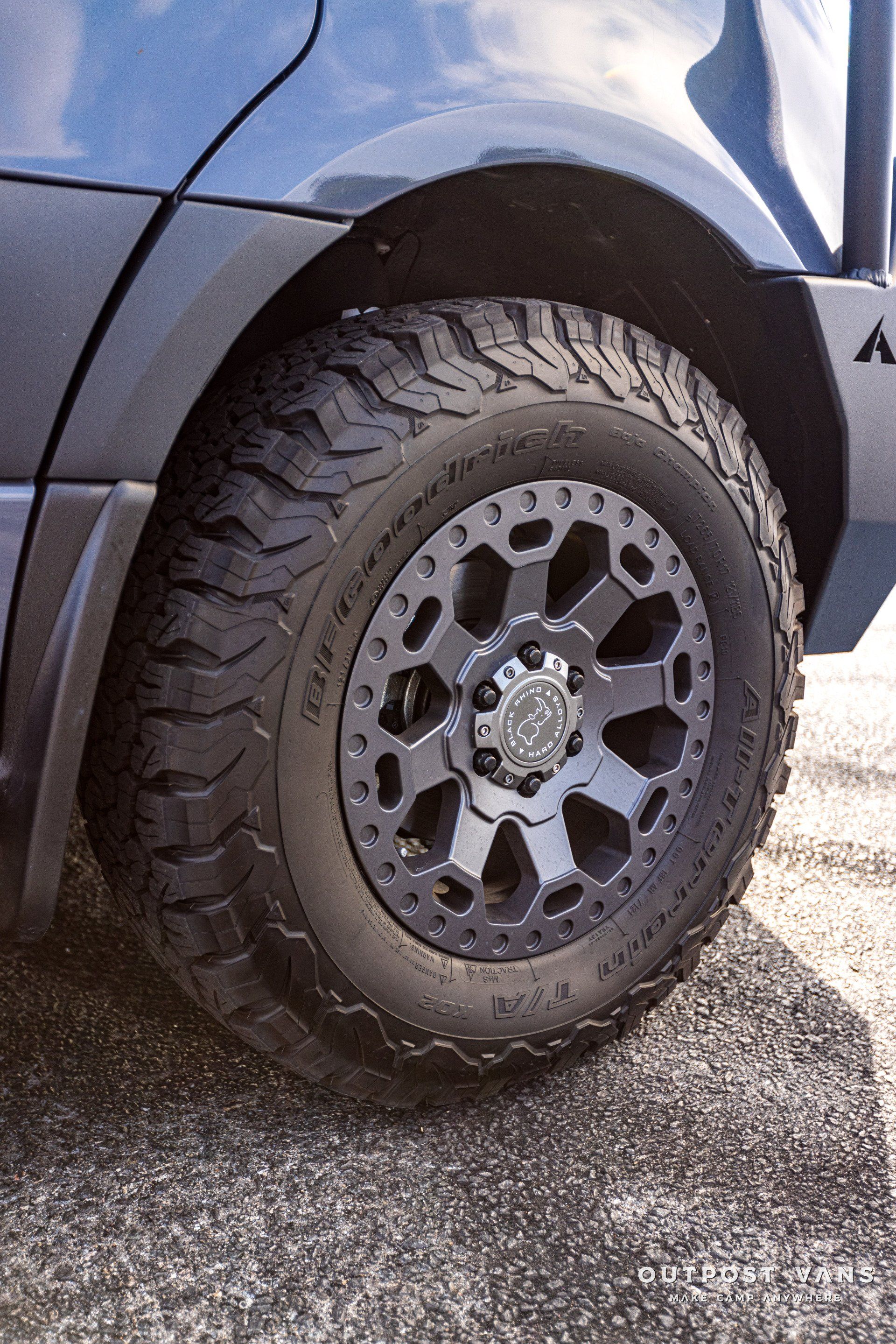 A close up of a car wheel with a tire on it.