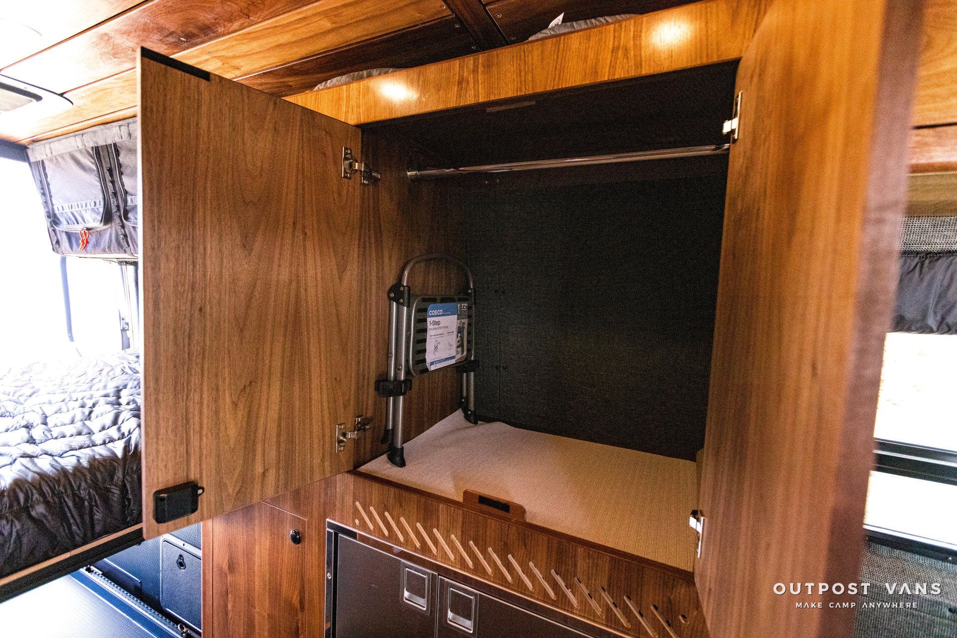 A wooden cabinet with a bed inside of it.
