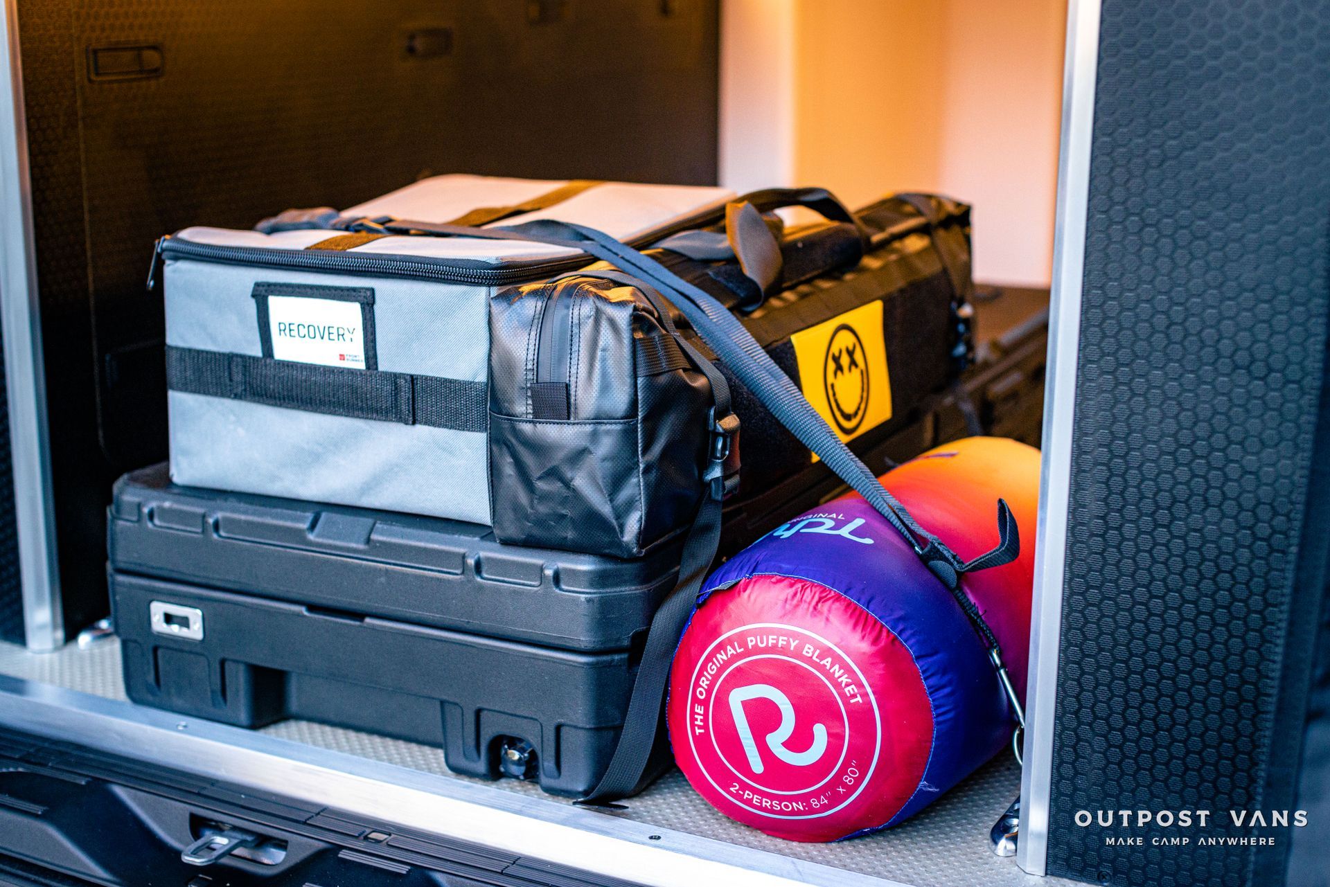 a bunch of luggage is stacked on top of each other in the back of a van .