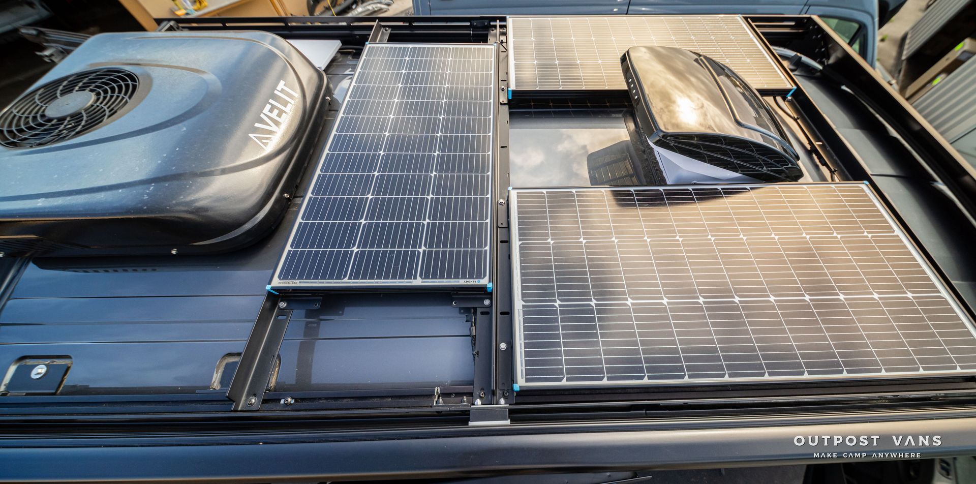 Solar panels and rooftop equipment mounted on a modern building roof.