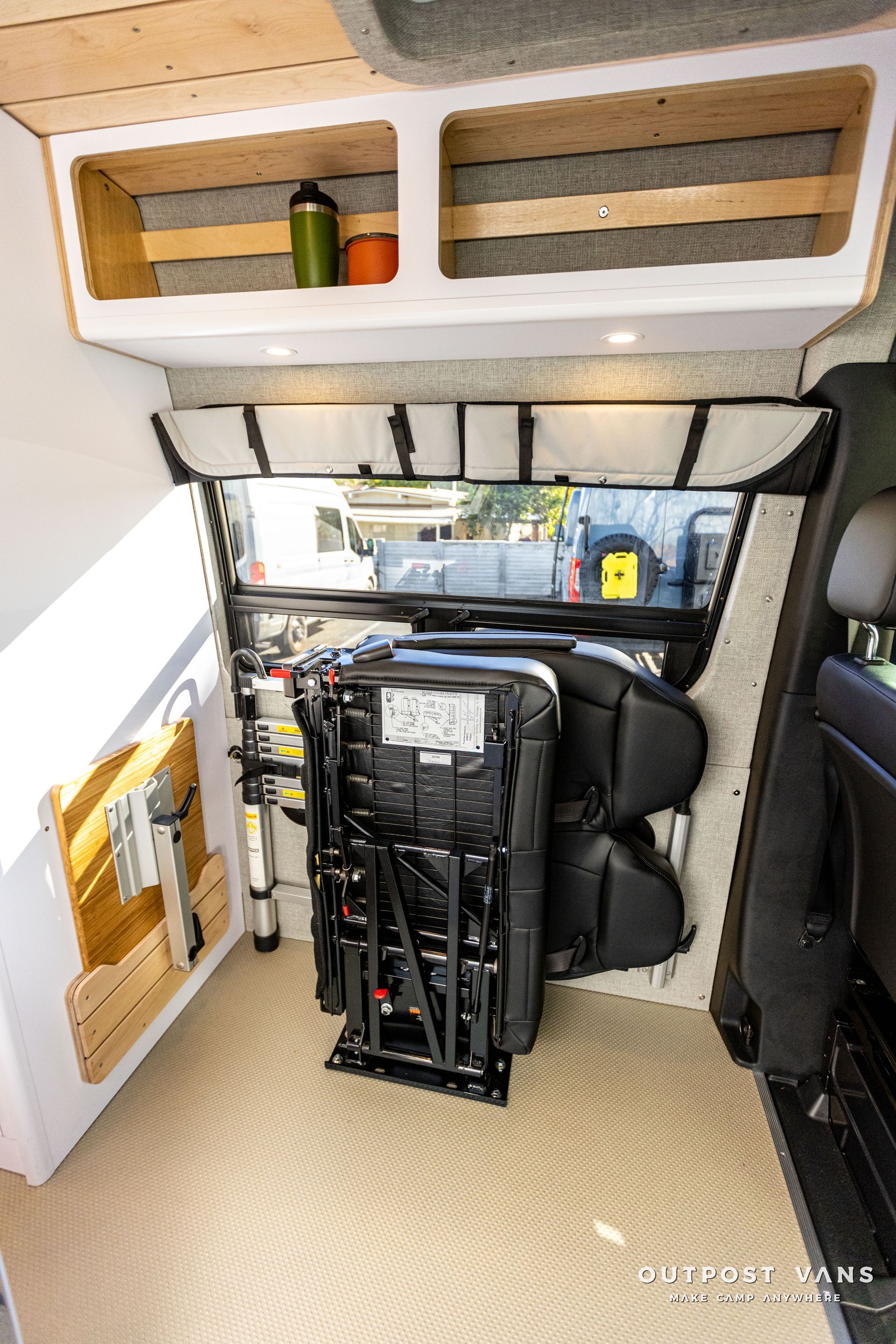 a car seat is sitting in the back of a van .