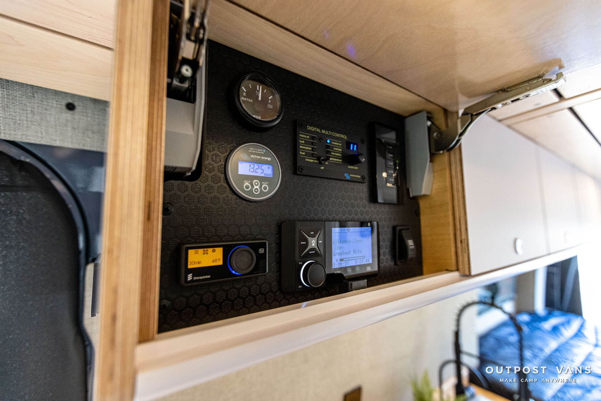 a rv with a lot of electronics on the wall .