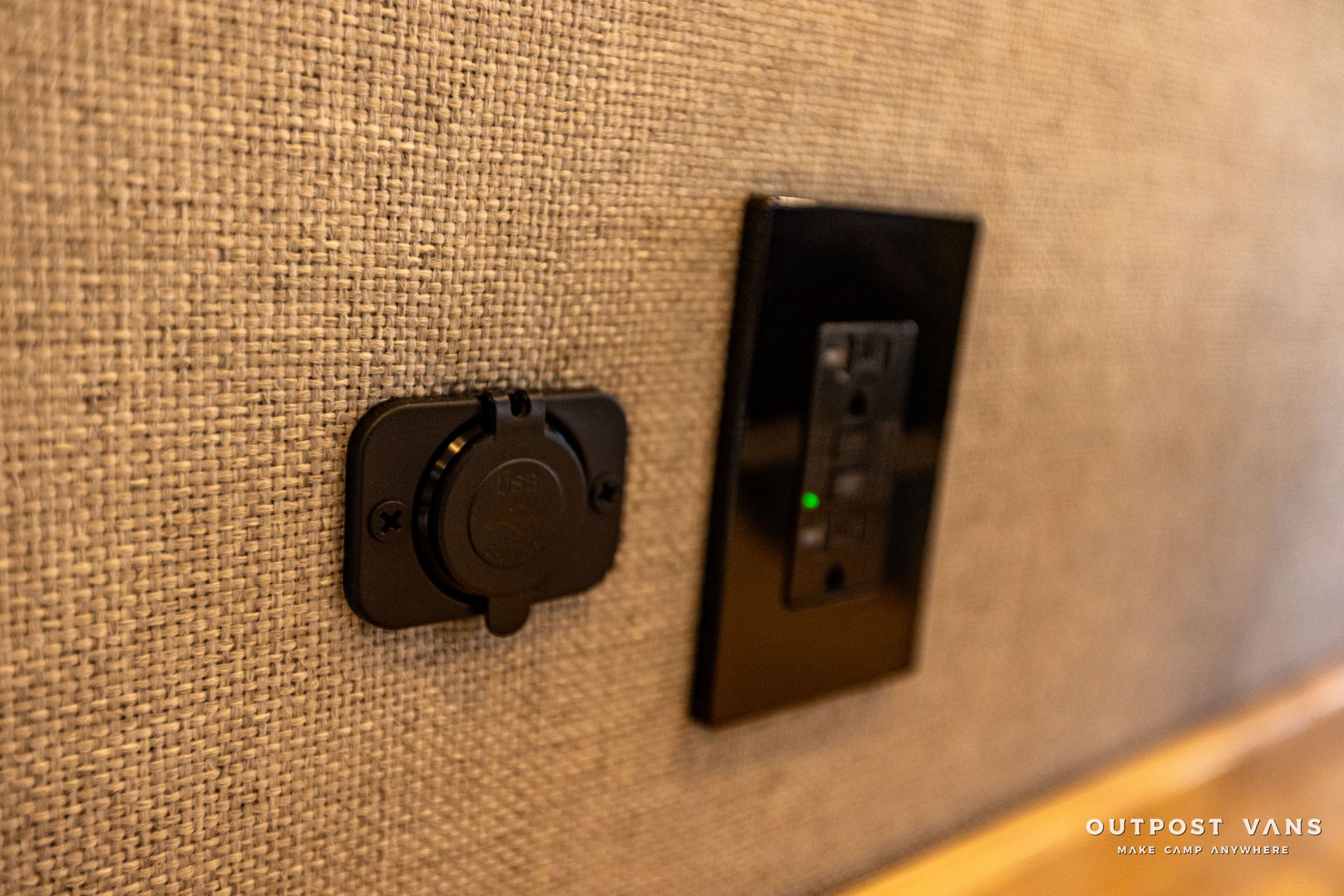 a close up of a electrical outlet on a wall .