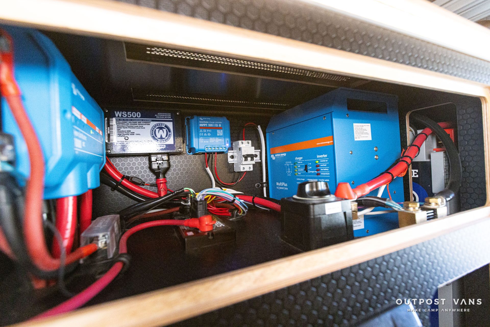 the inside of a van with a lot of wires and electrical equipment