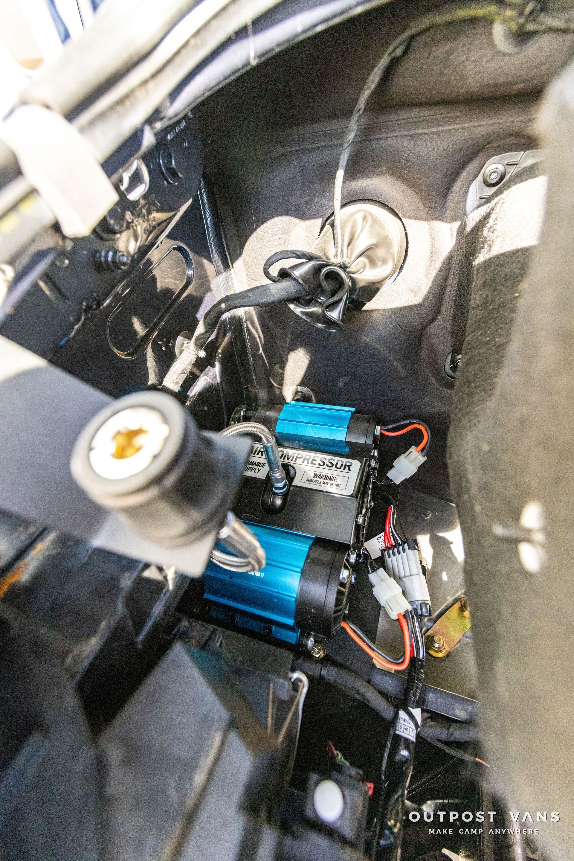 a close up of the inside of a car with a air compressor .